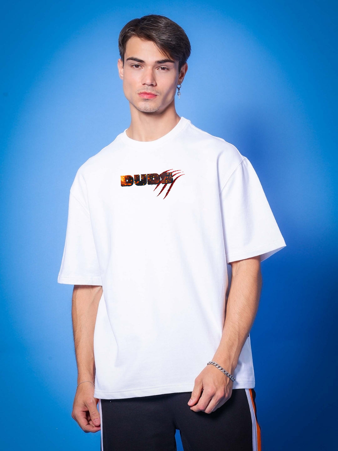 Model wearing ANGRY PANTHER OVERSIZED T-SHIRT WHITE against blue background