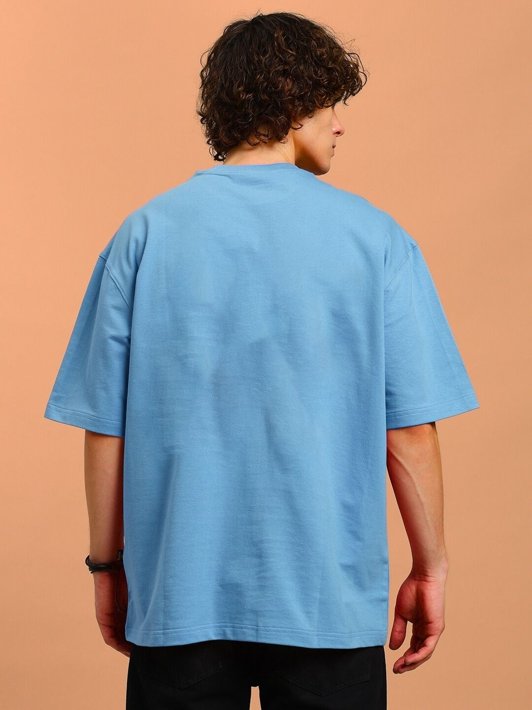Back view of ANGRY SNAKE WD PRINTED OVERSIZED T-SHIRT LIGHT BLUE worn by a model.