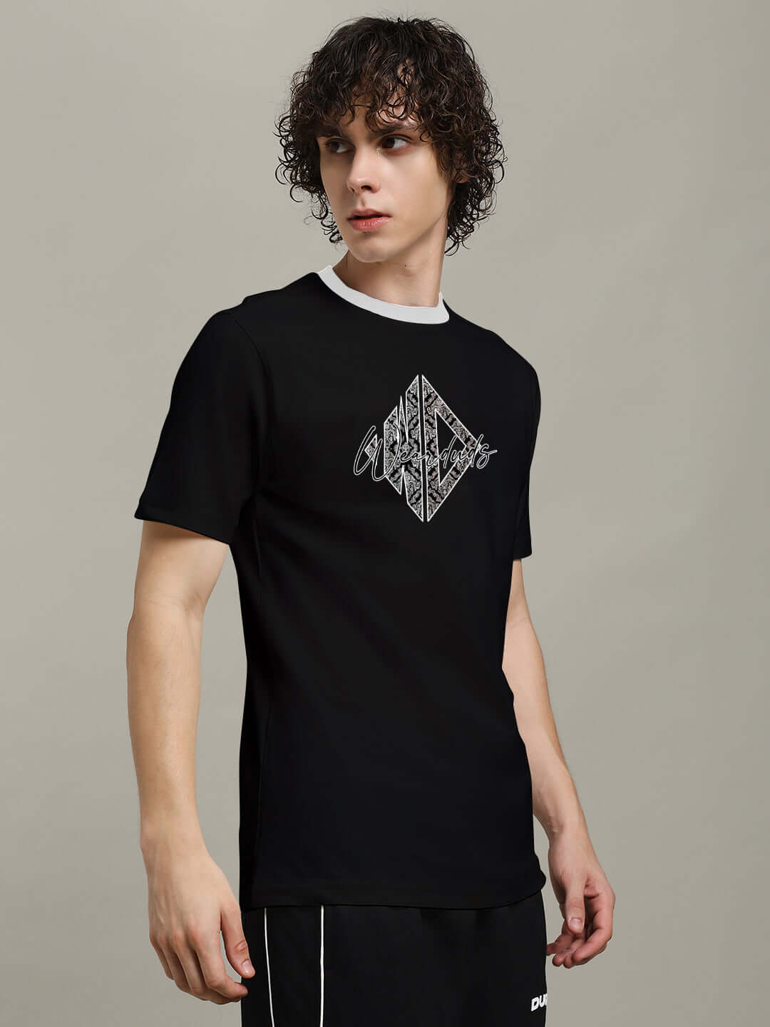 Model wearing Angular Regular Fit T-Shirt Black with angular graphic print, showcasing casual style and comfort.
