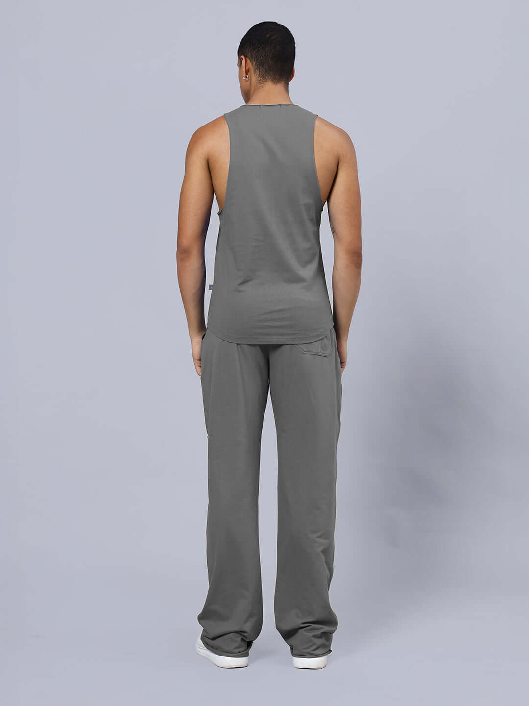 Model wearing ANIMAL PRINTED RELAXED FIT CO-ORD SET GREY showcasing back view with relaxed fit joggers and sleeveless top.