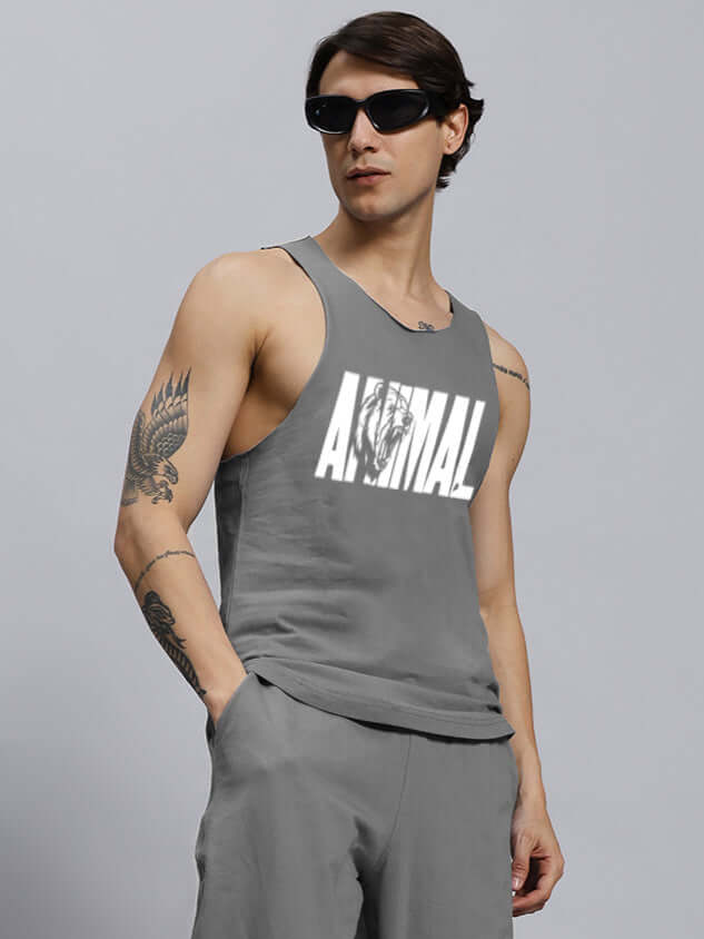 Grey animal printed gym t-shirt with custom fit option, worn by model, showcasing athletic fit and tattooed arms.