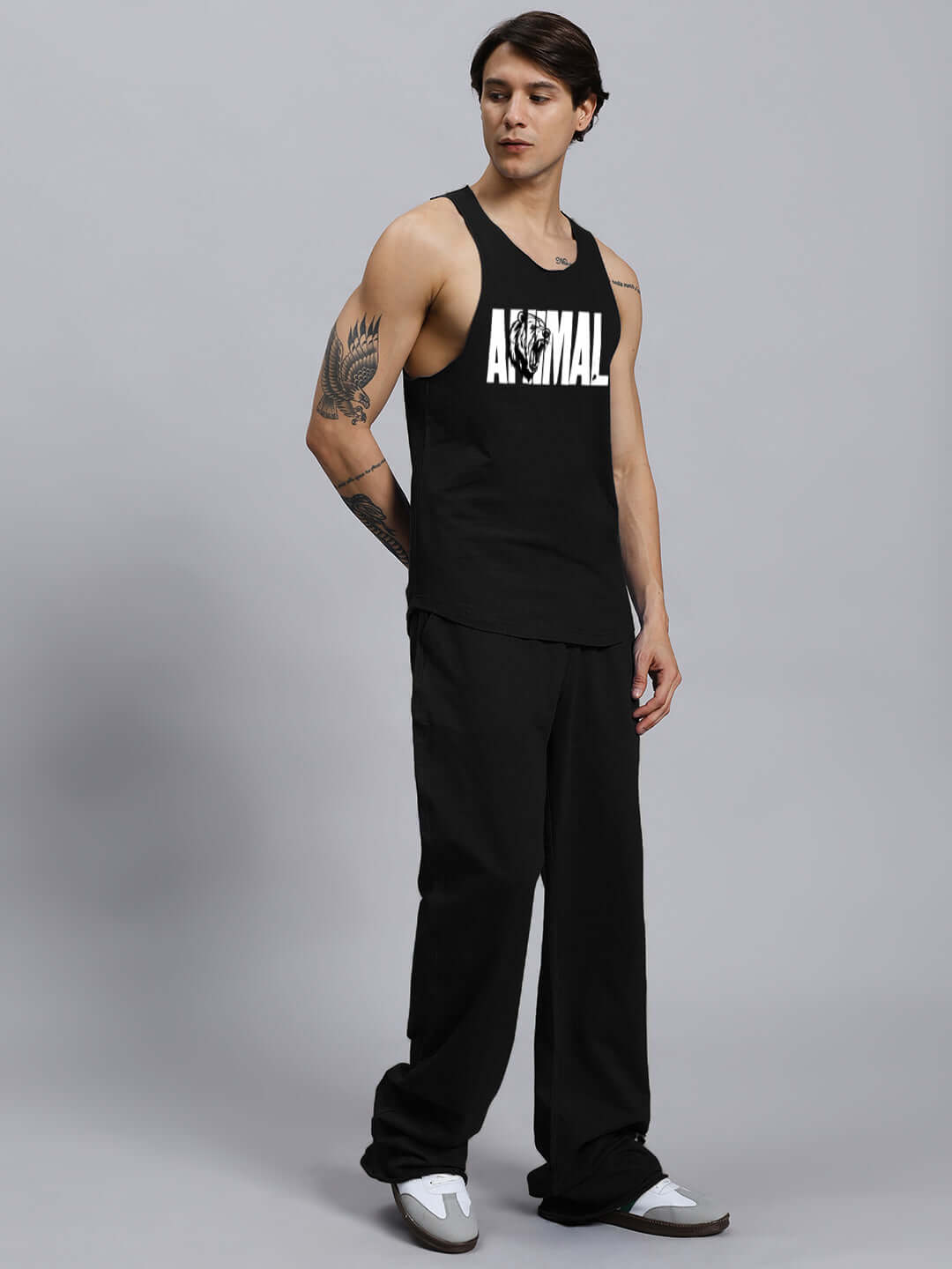 ANIMAL PRINTED RELAXED FIT CO-ORD SET BLACK with unisex joggers and tank top, 100% cotton, styled by a model.