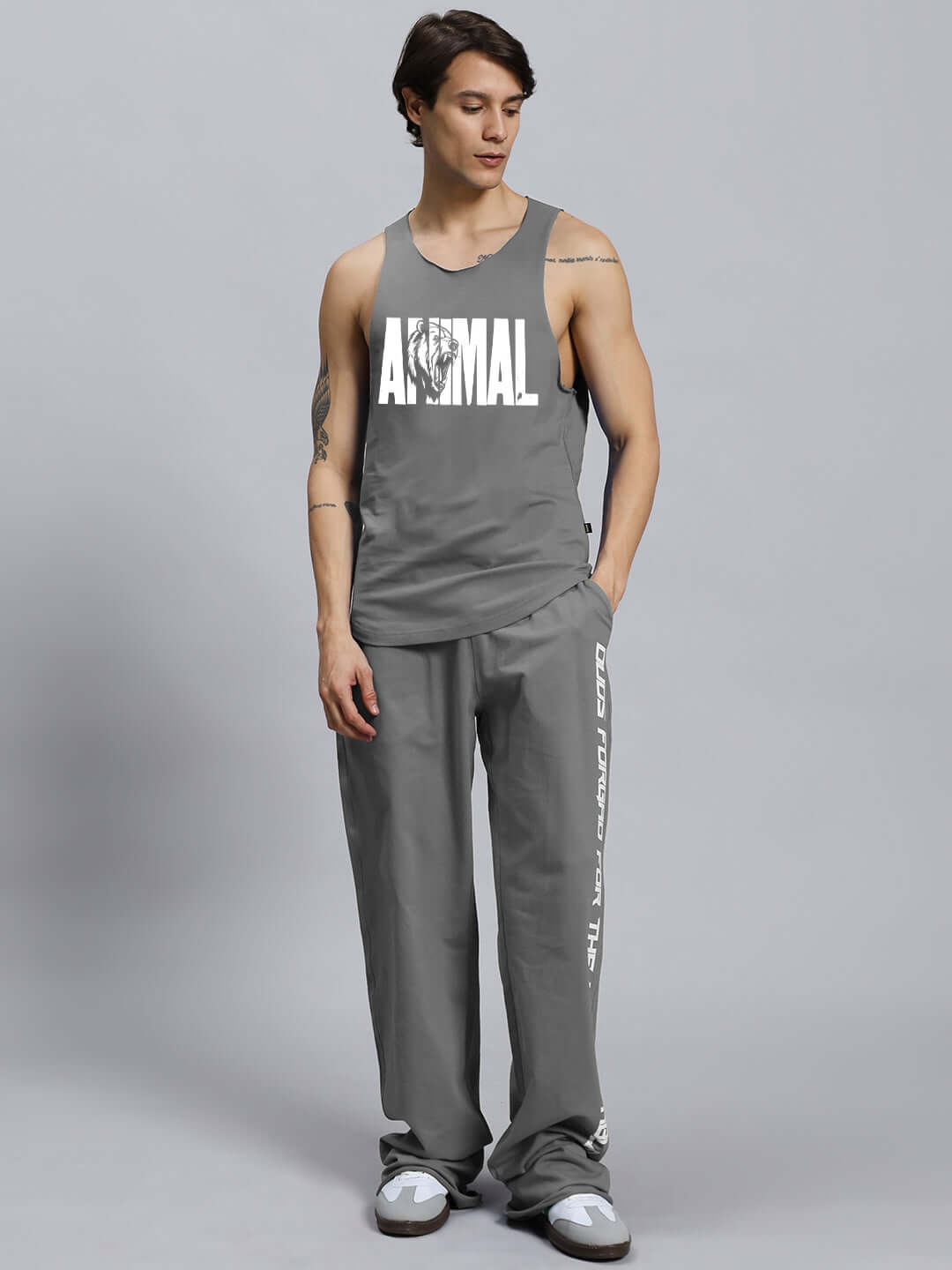 ANIMAL PRINTED RELAXED FIT CO-ORD SET GREY on model, featuring unisex joggers with elasticated waistband and drawstring.