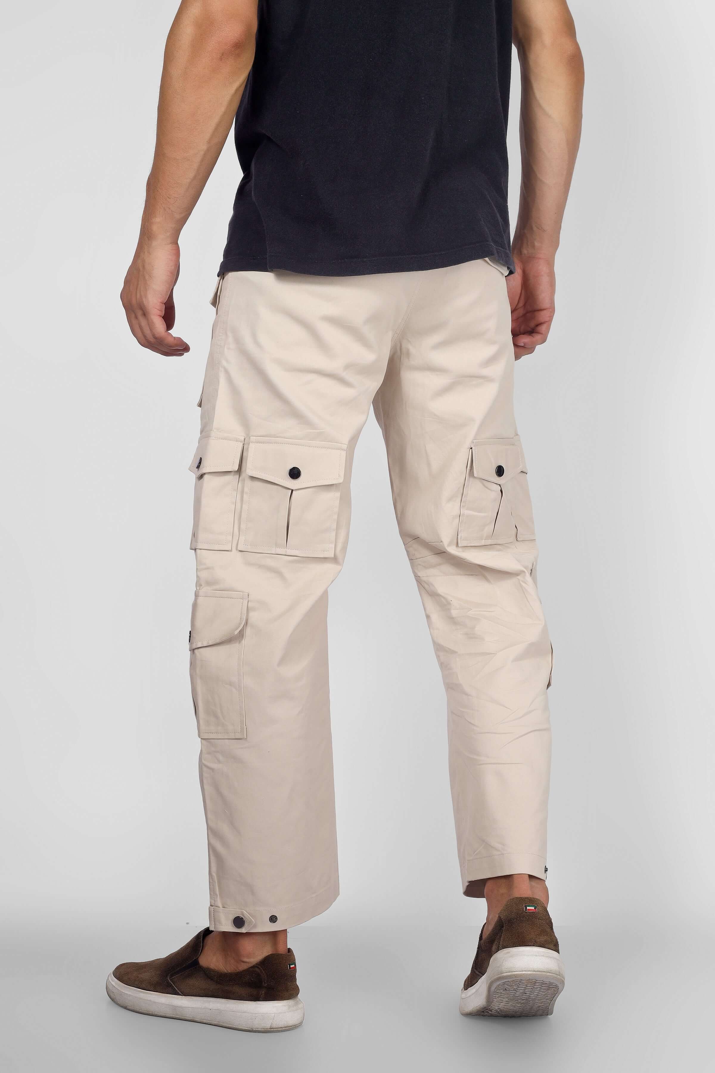 Model wearing Arcadia White 14 Pocket Cargo Pants from DUDS, showcasing tailored fit and multiple functional pockets.