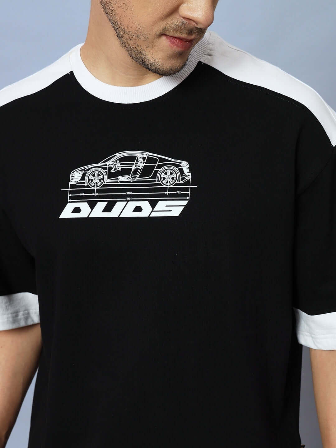 Man wearing AUDI R8 OVERSIZED T-SHIRT BLACK with car graphic