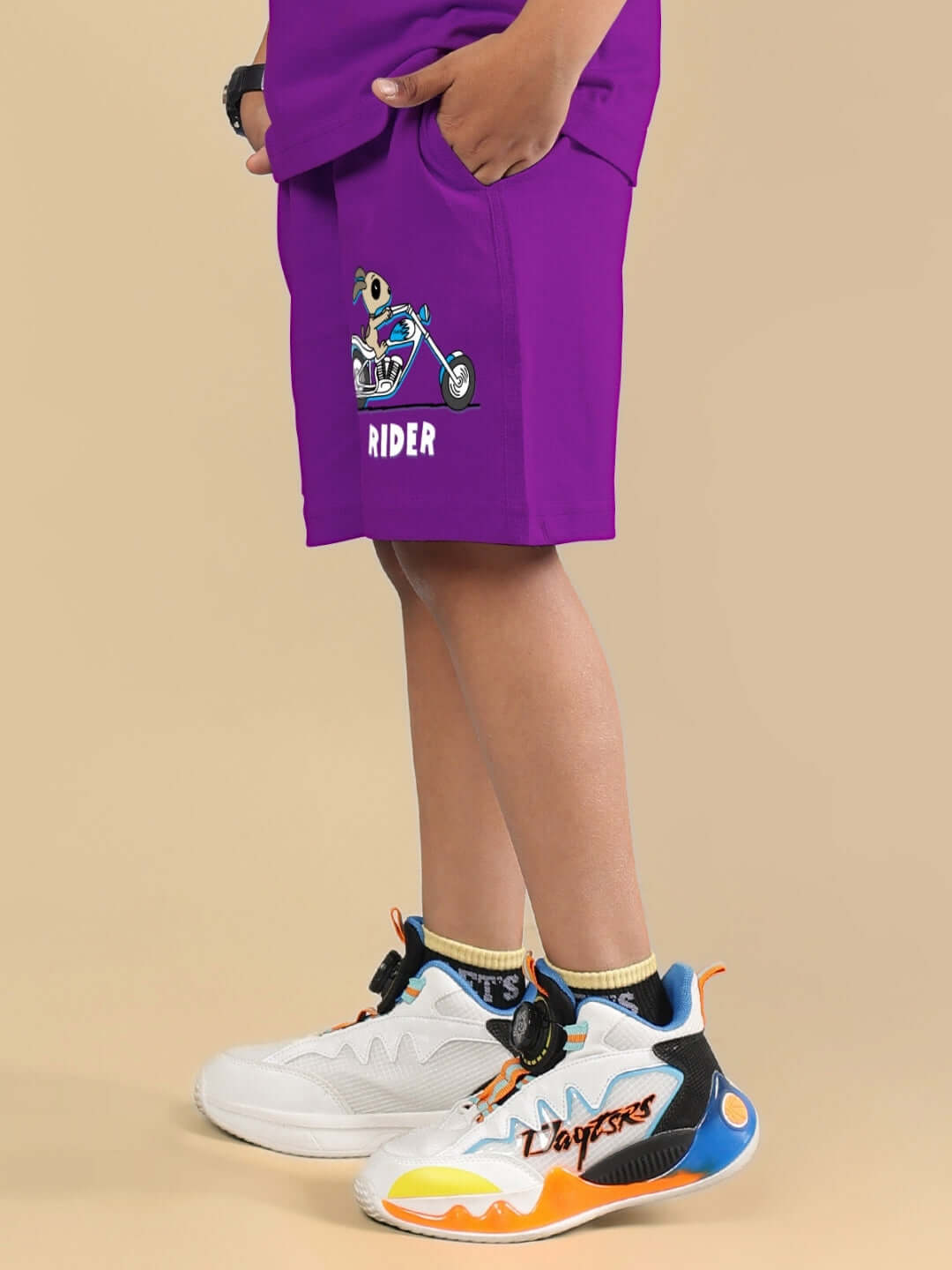 Purple authentic rider shorts for boys and girls, made to order by DUDS, featuring a playful graphic. Custom fit available on request.