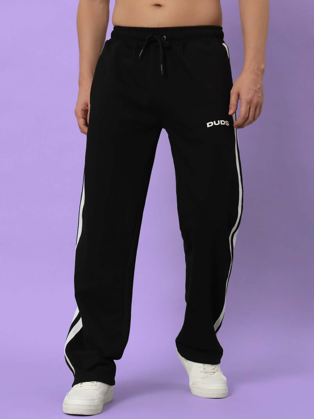 Black-white AVALON slit zipper joggers by DUDS, worn by model, featuring side stripes, customizable fit, made-to-order.