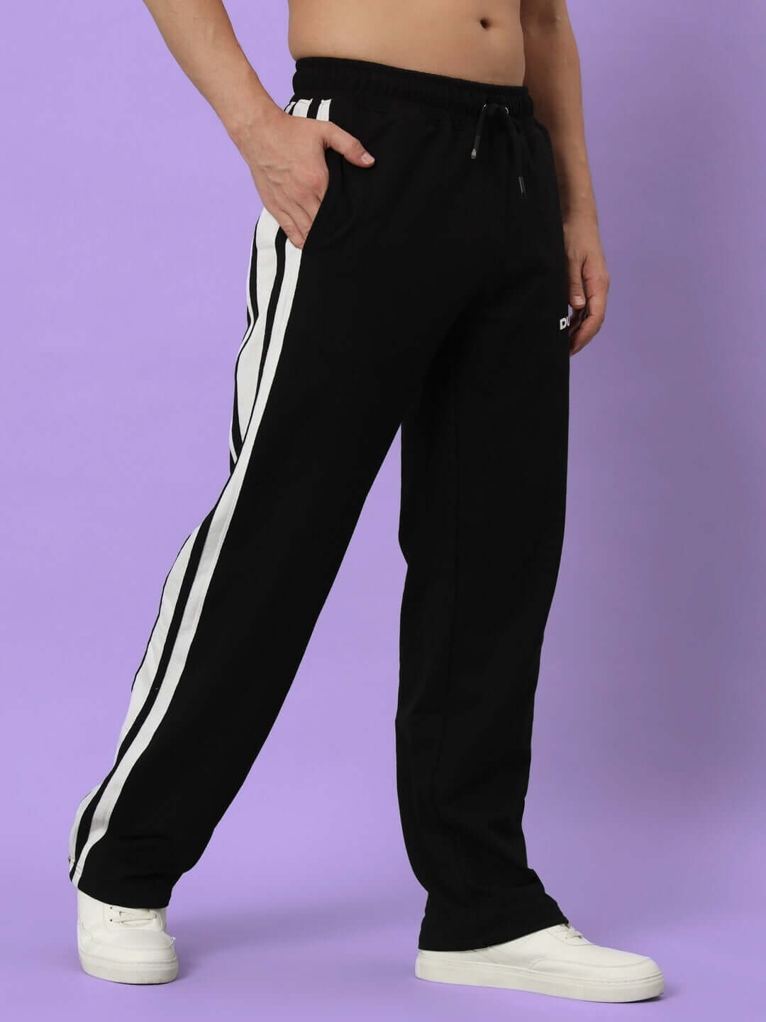 Model wearing Avalon Slit Zipper Joggers in Black-White with custom fit option, showcasing stylish side stripes.