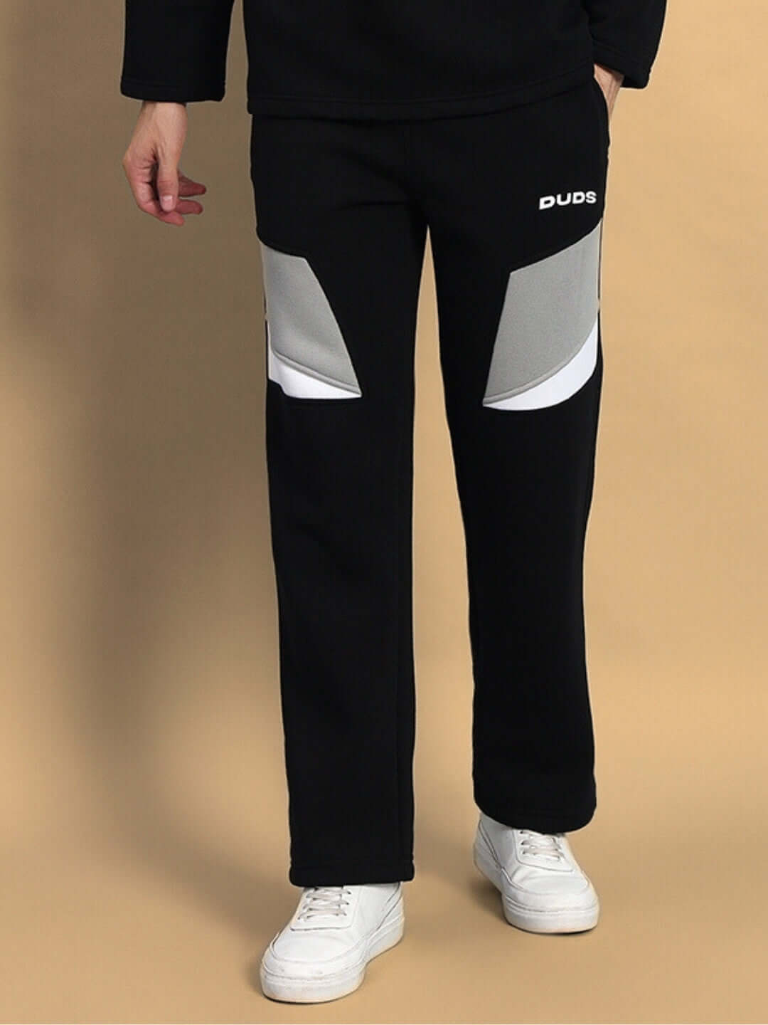 Model wearing AVIATOR FLEECE CARGO PANT BLACK by WEAR DUDS, featuring comfortable and stylish fleece fabric, perfect for streetwear.