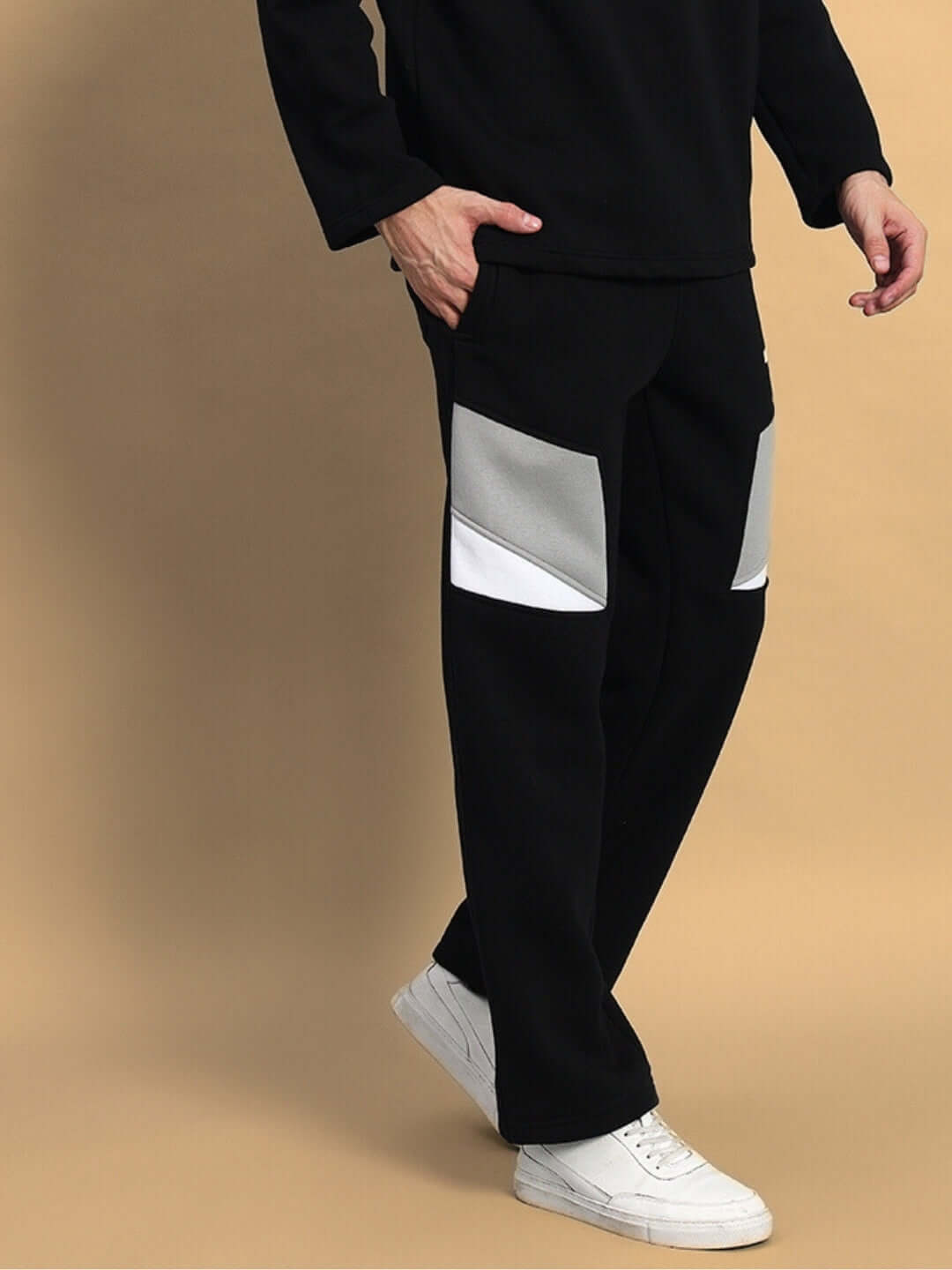 Model wearing AVIATOR FLEECE CARGO PANT BLACK, featuring stylish design and premium fleece fabric, perfect for streetwear fashion.