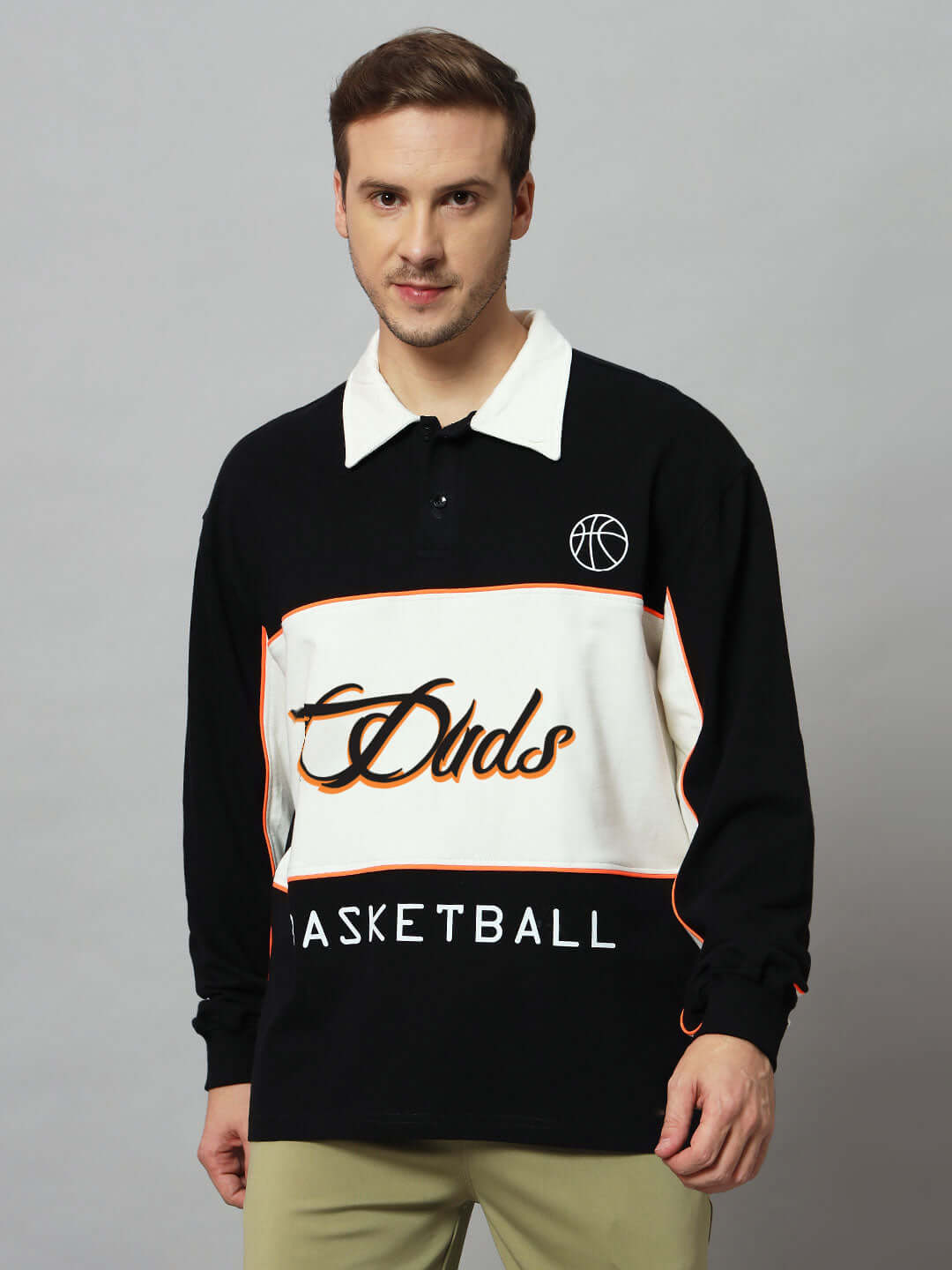 Model wearing B-Ball Oversized Sweatshirt in Black and Off White, featuring premium cotton fabric and basketball design.