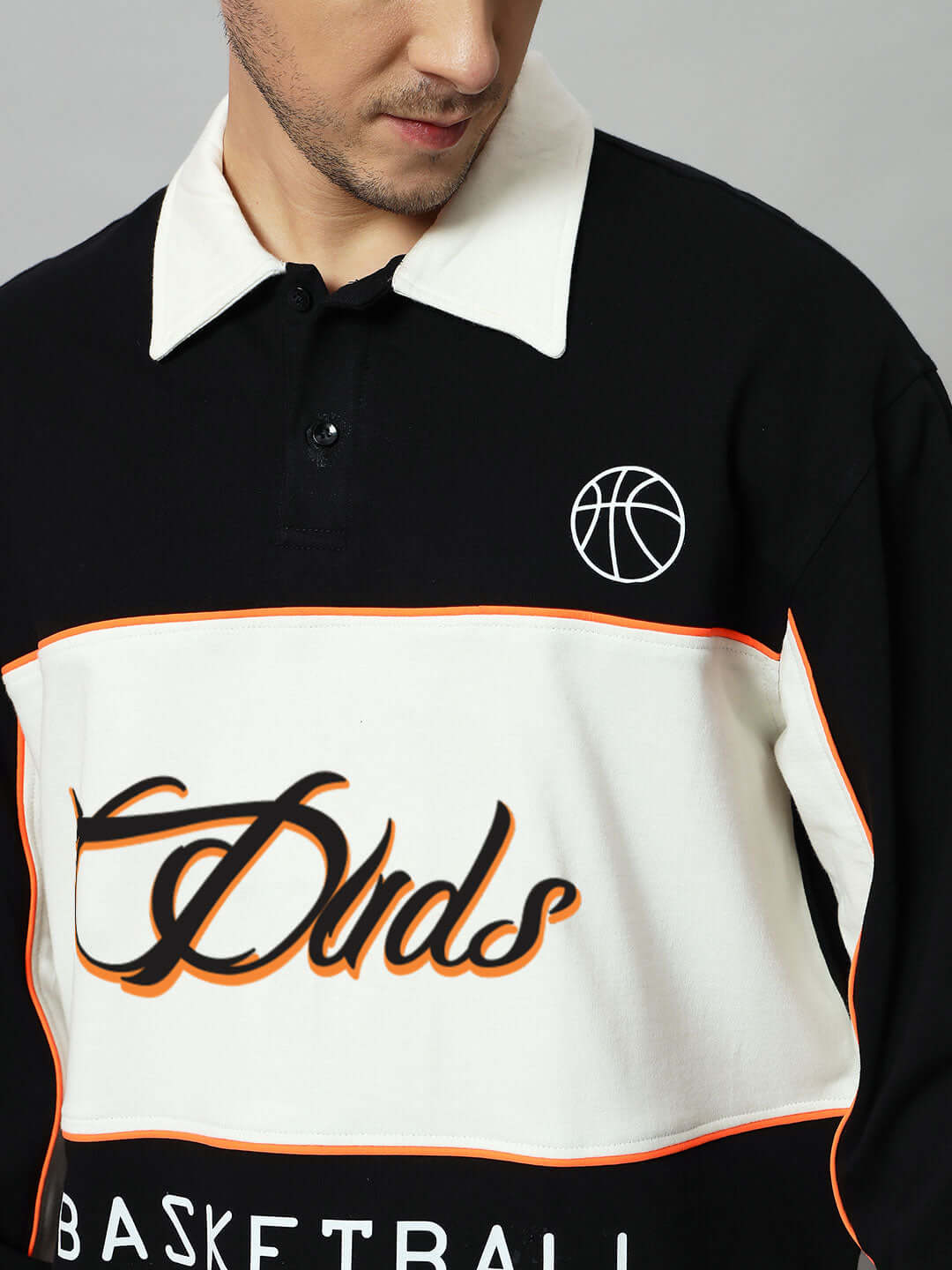 Black and off-white oversized sweatshirt with basketball graphic and bold lettering, featuring premium cotton terry for comfort and style.