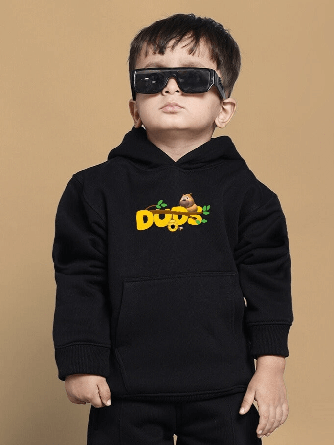 Child wearing BABLU DABLU black fleece hoodie with bear graphic, suitable for boys and girls, stylish and comfortable fashion.