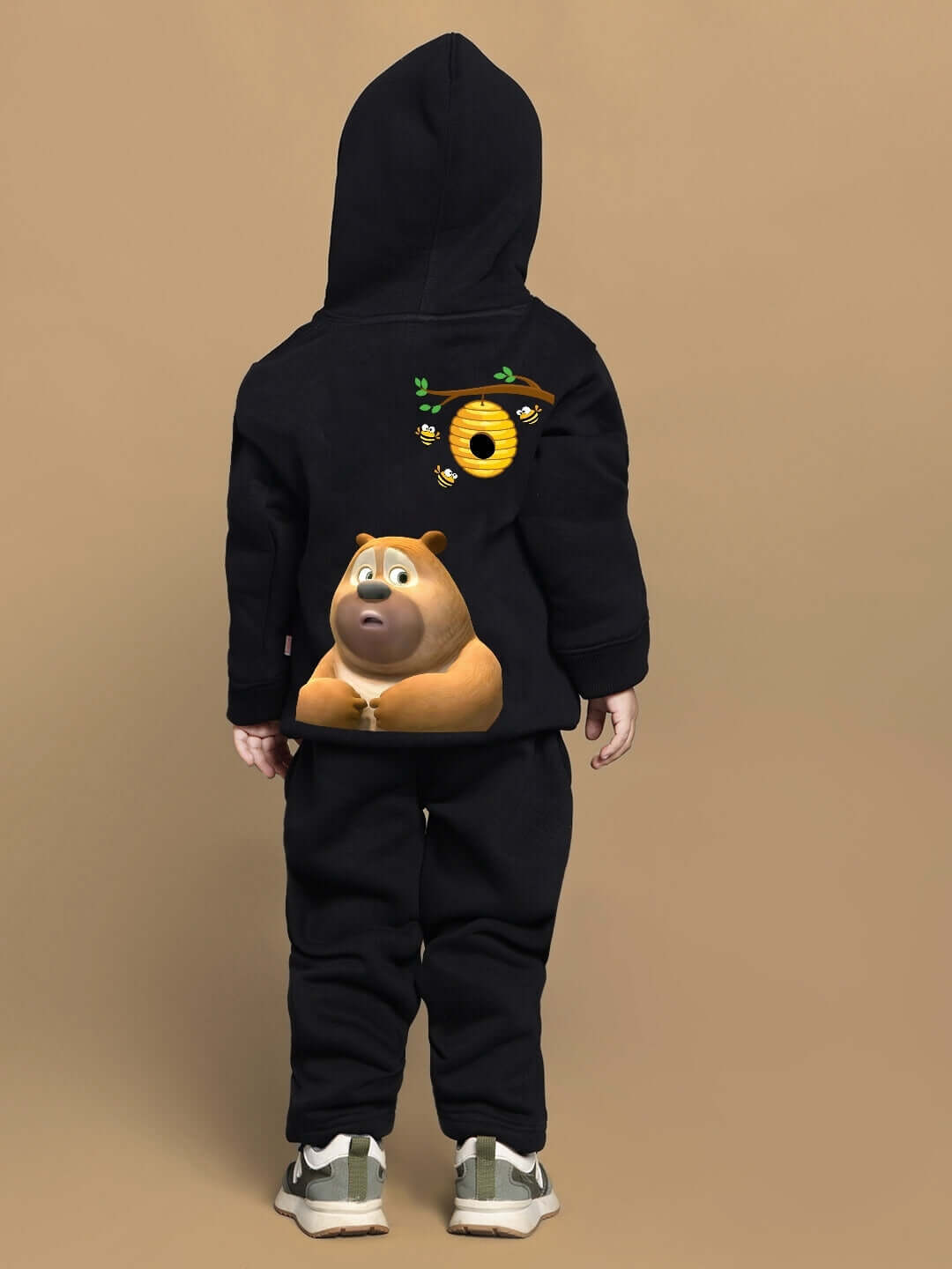 Child wearing black Bablu Dablu co-ord set featuring character design on the back, suitable for boys and girls.