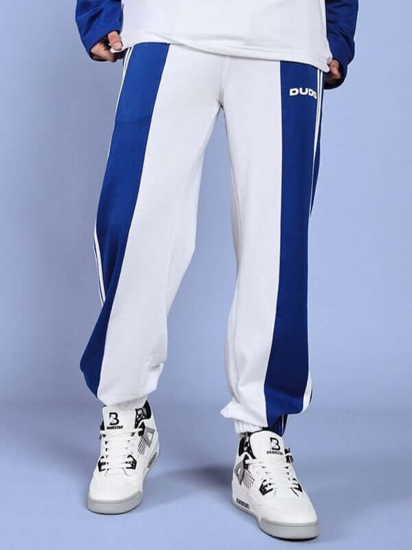 White and blue relaxed fit joggers by DUDS, featuring customizable sizing and comfortable design, made to order for perfect fit.
