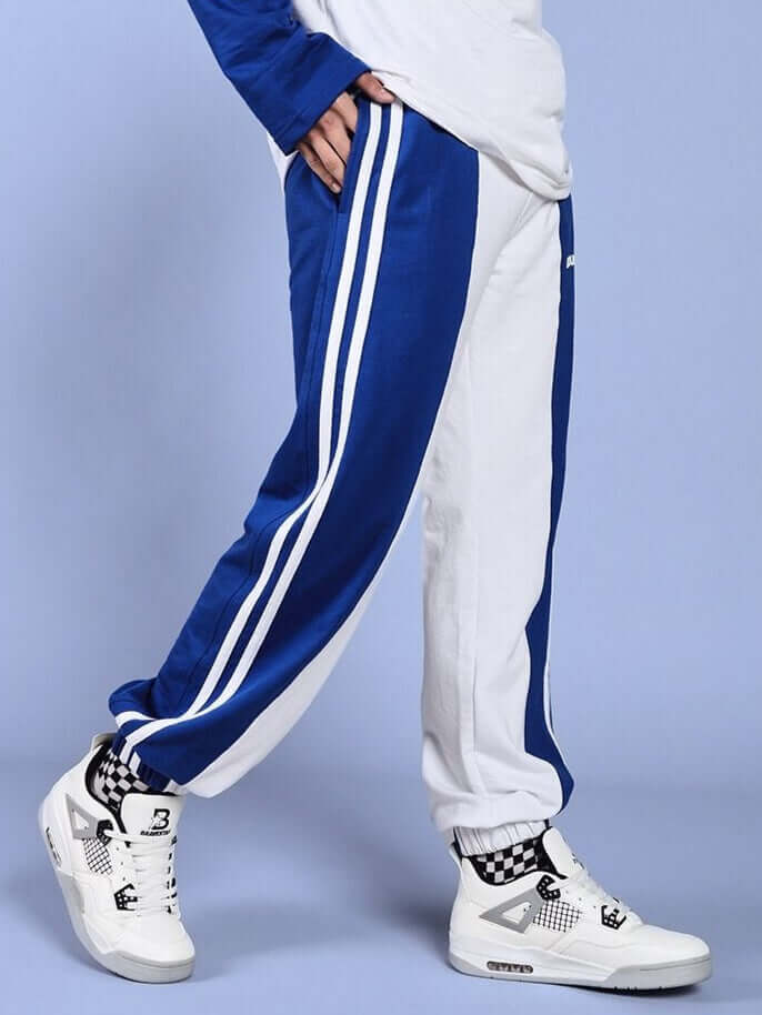 Person wearing Balmy Relaxed Fit Jogger in white-blue with sneakers; stylish made-to-order fashion by DUDS.
