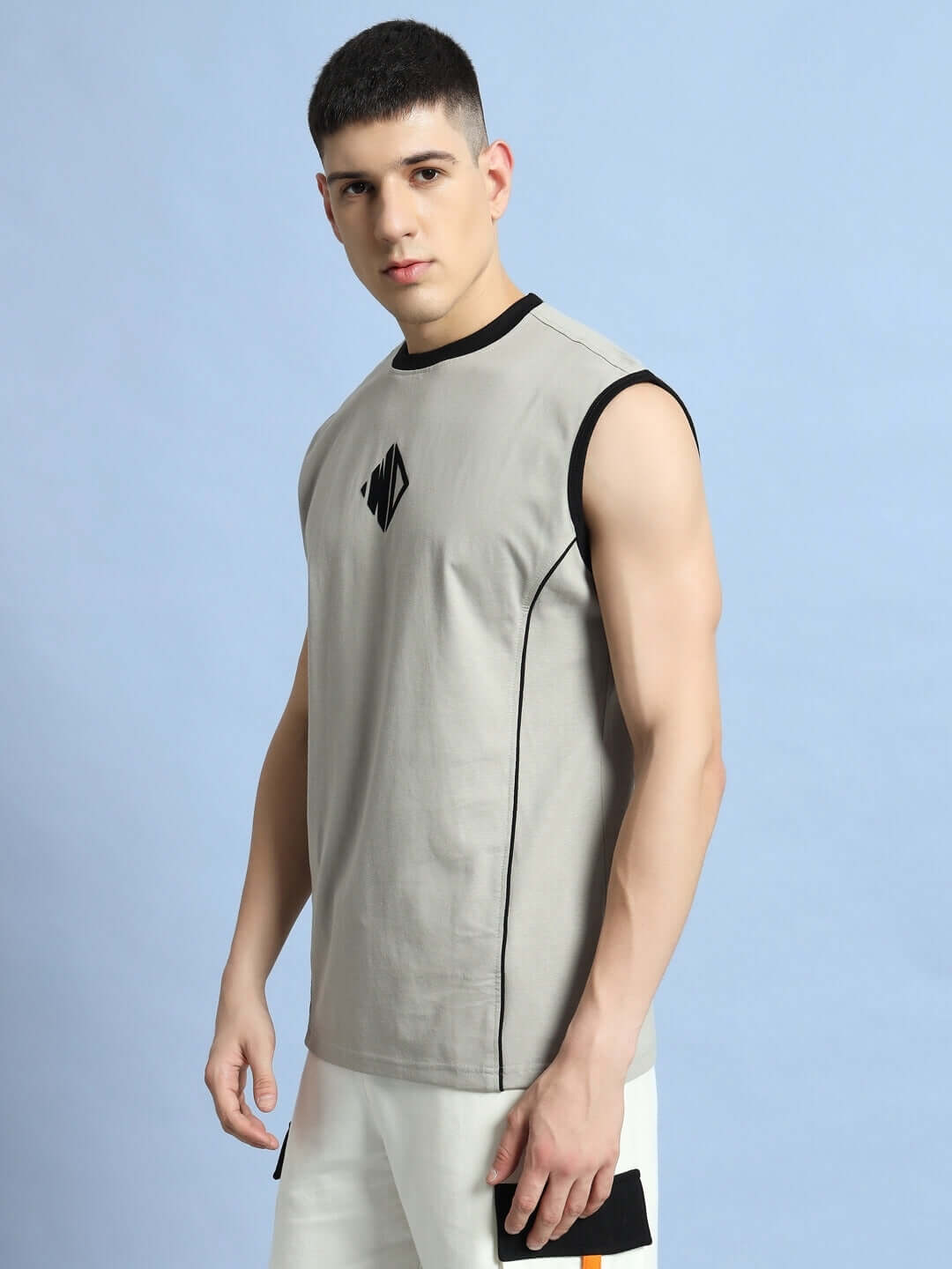 Man wearing a grey Bare Arms gym t-shirt with a stylish black neckline, perfect for workouts. Custom fit options available.