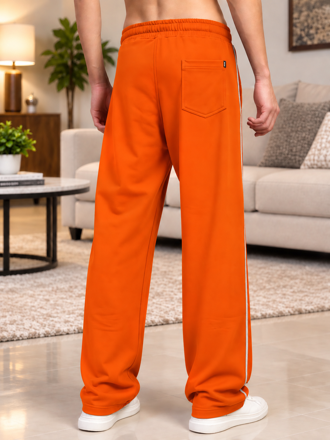 BEAT MODE FIT COTTON TERRY JOGGERS ORANGE worn by man, back view showcasing comfy fit and stylish design for casual loungewear