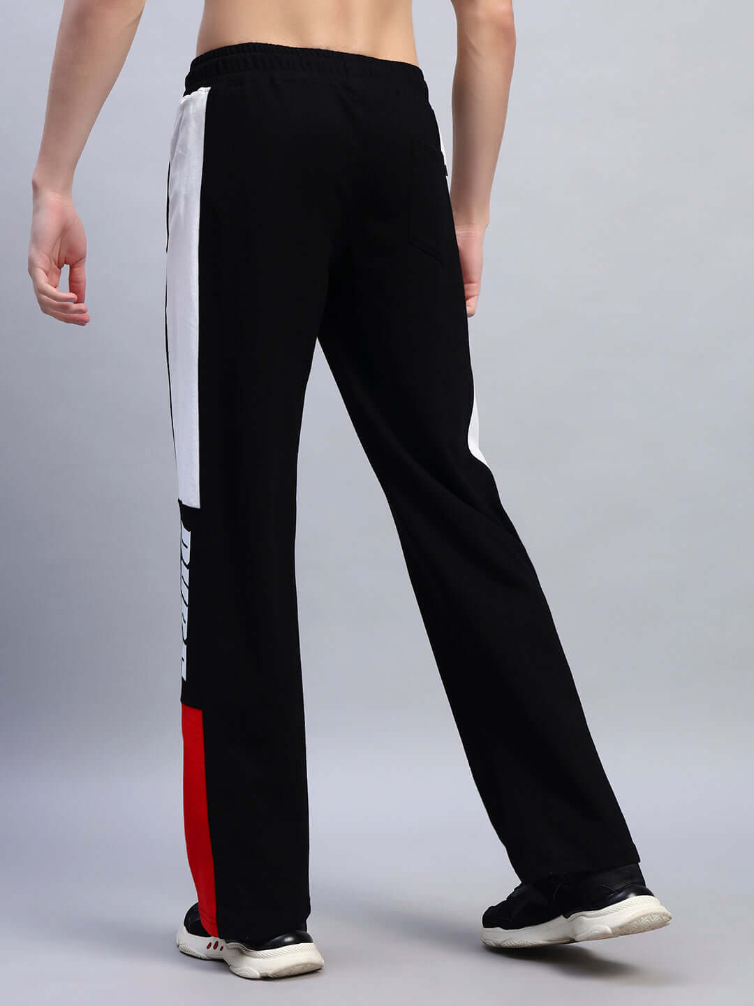 Back view of BELGIANS Relaxed-Fit Joggers in black and red, featuring custom fit option and comfortable design.