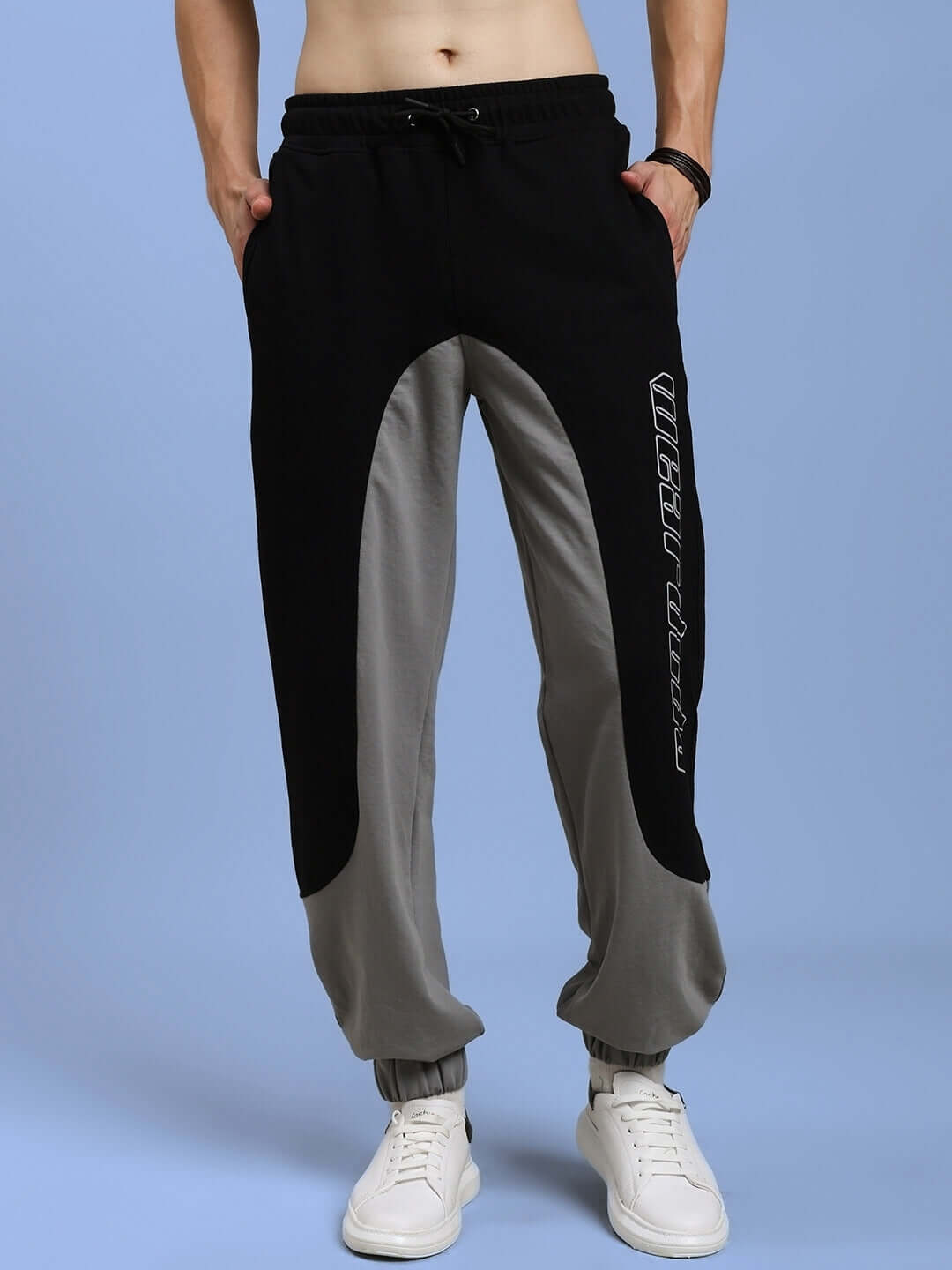 Stylish black and grey relaxed fit joggers for men, perfect for casual wear, made-to-order by DUDS, available in custom sizes.