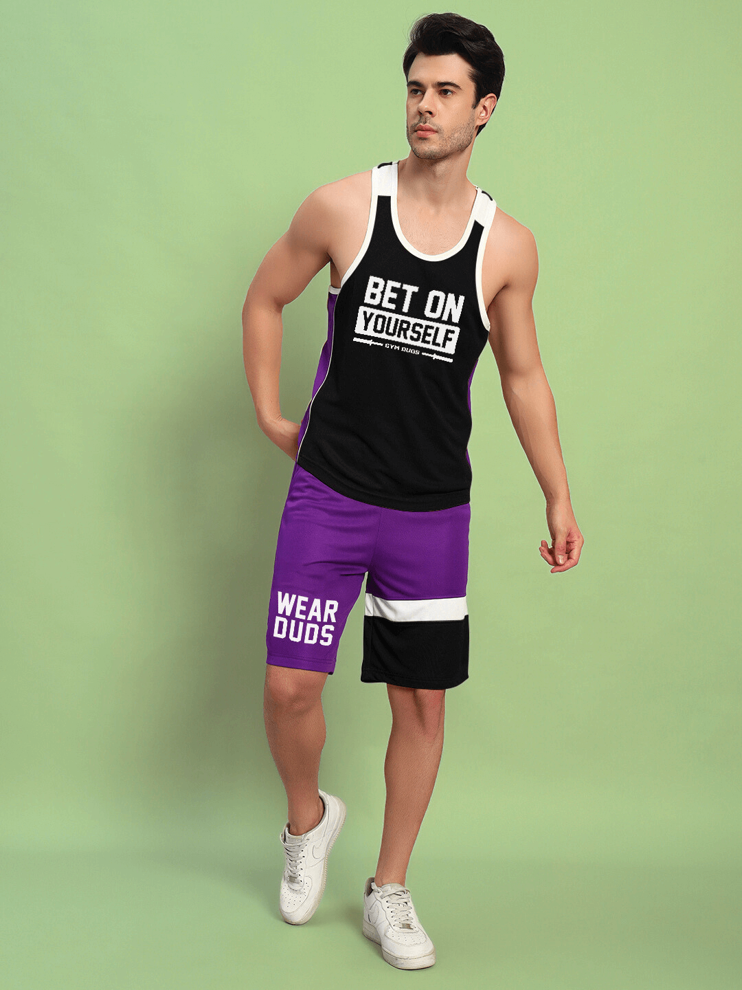 Man wearing BET ON YOURSELF GYM CO-ORD SET BLACK PURPLE made of sports polyester fabric, ideal for workouts.
