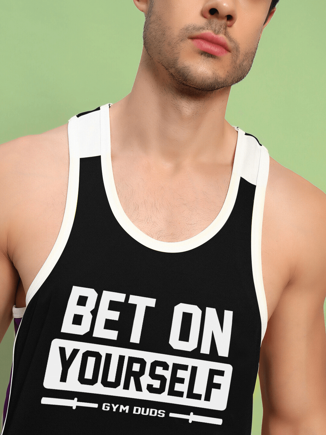 Man wearing BET ON YOURSELF GYM CO-ORD SET BLACK PURPLE tank top.