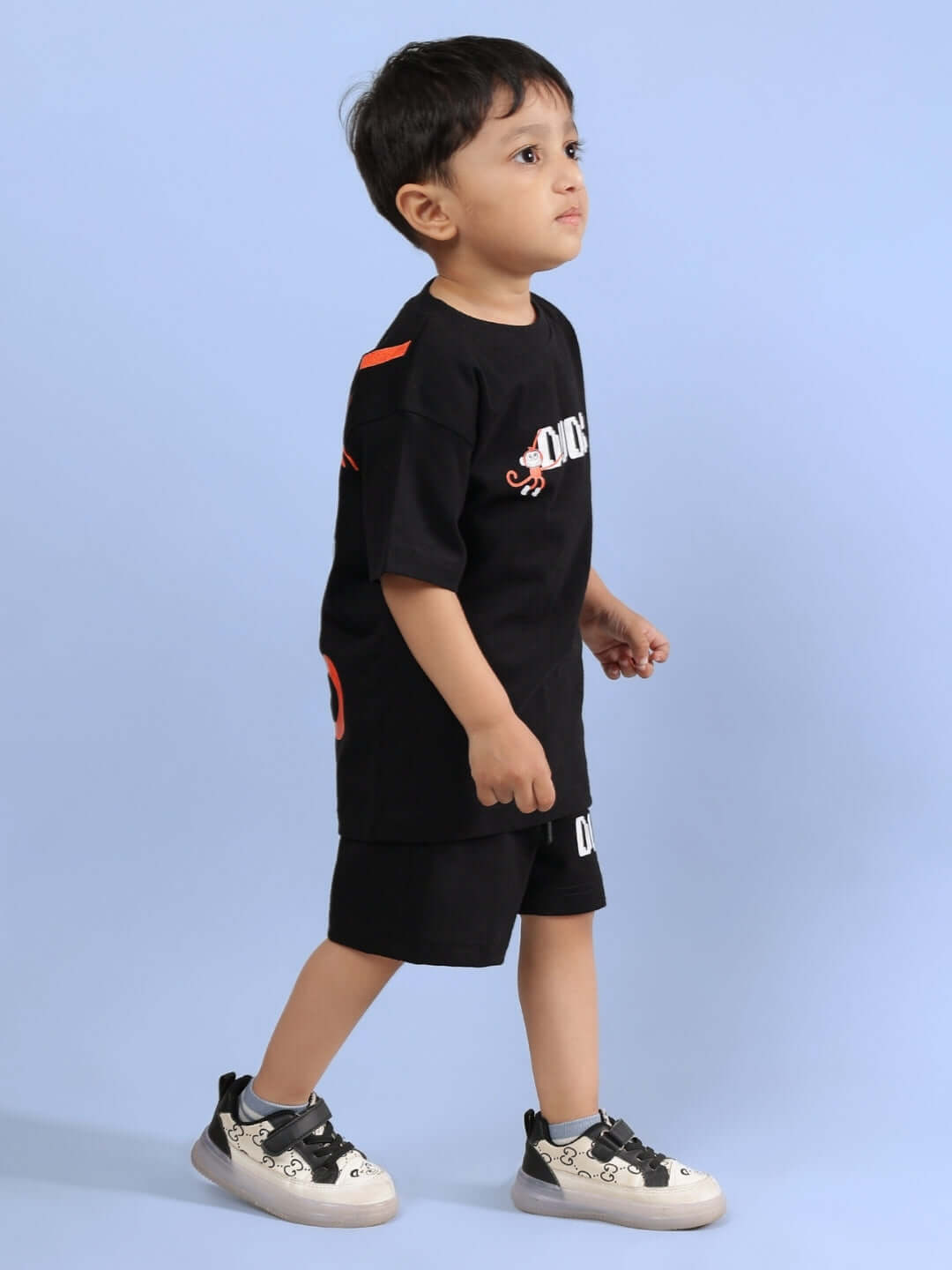 Child wearing BINGO CO-ORD FOR BOYS & GIRLS BLACK set featuring a stylish black shirt and shorts.