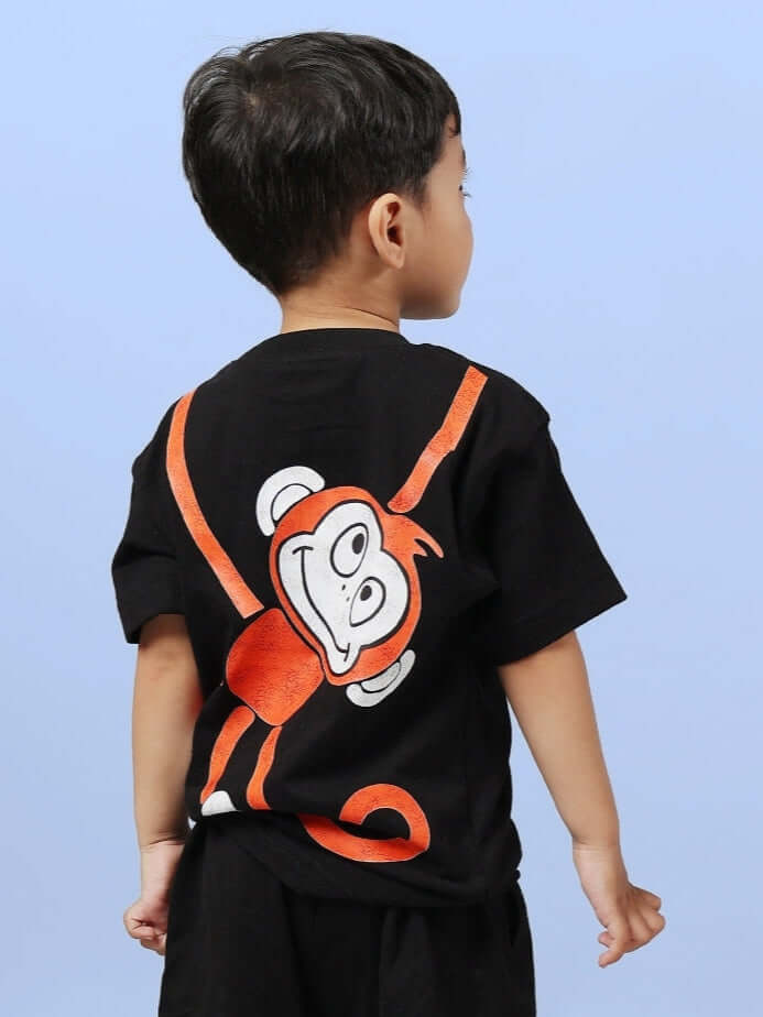 Child wearing black BINGO T-shirt featuring a playful orange monkey design on the back. Ideal for boys and girls. Custom fit available.