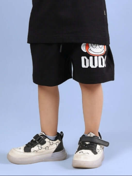 Child wearing black Bingo shorts with cartoon design from DUDS.