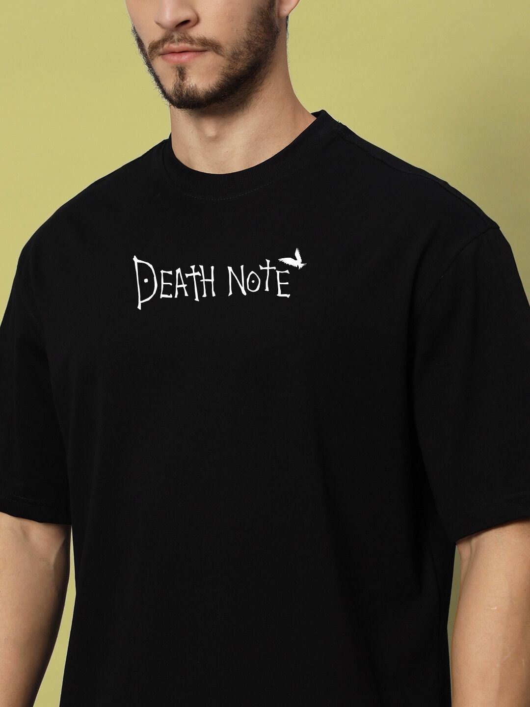 Close-up of a model wearing a black oversized t-shirt with 'Death Note' logo on the chest, perfect for casual wear.