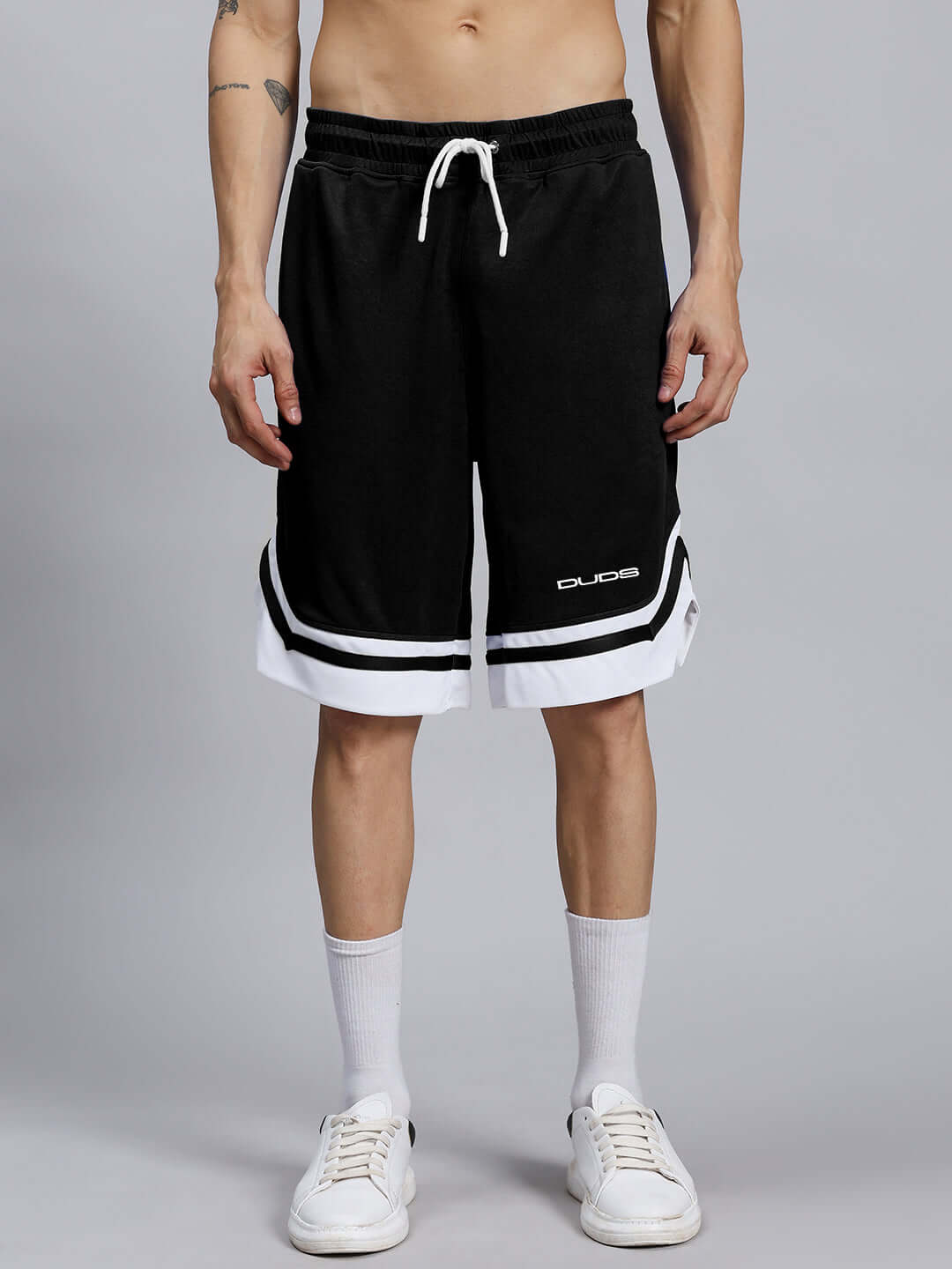 Men wearing FLEX GYM SLEEVELESS CO-ORD SET BLACK, polyester sports fabric shorts, front view showing elastic waist and white trim detail.