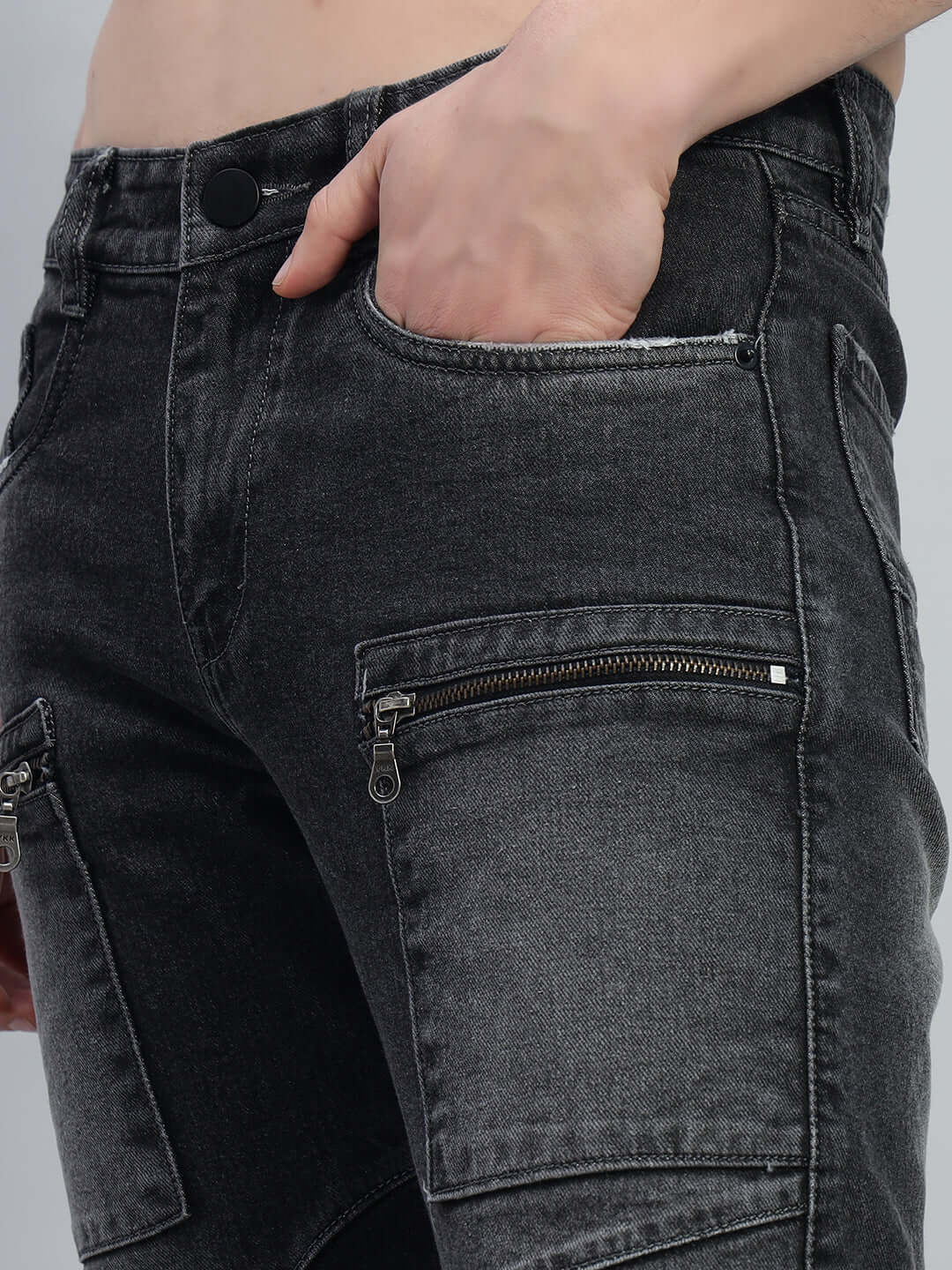 Detailed view of black regular fit denim jeans with zipper pockets, tailored by DUDS. Custom size available for prepaid orders.