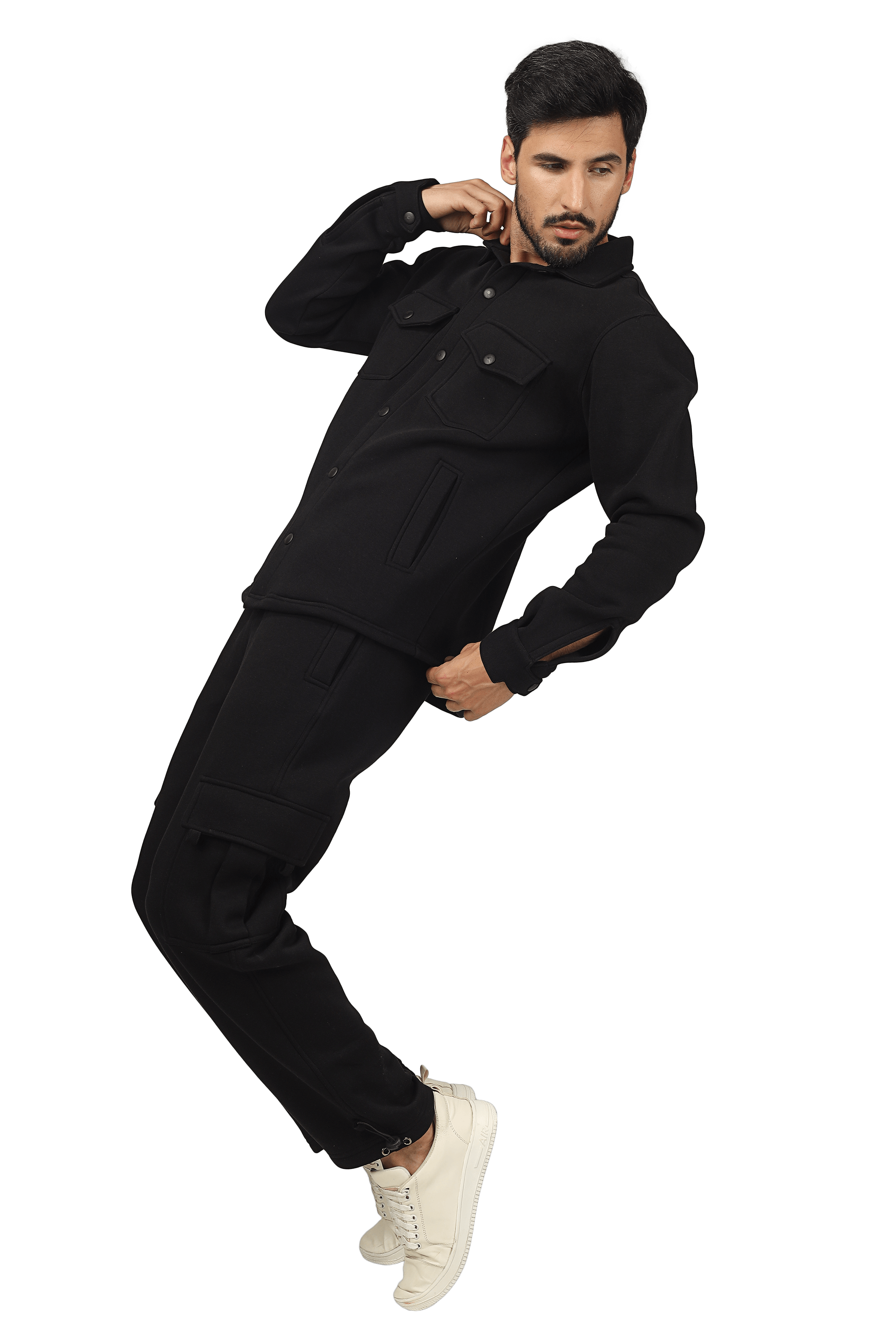 Model wearing black relaxed fit full overshirt with matching pants and white sneakers.