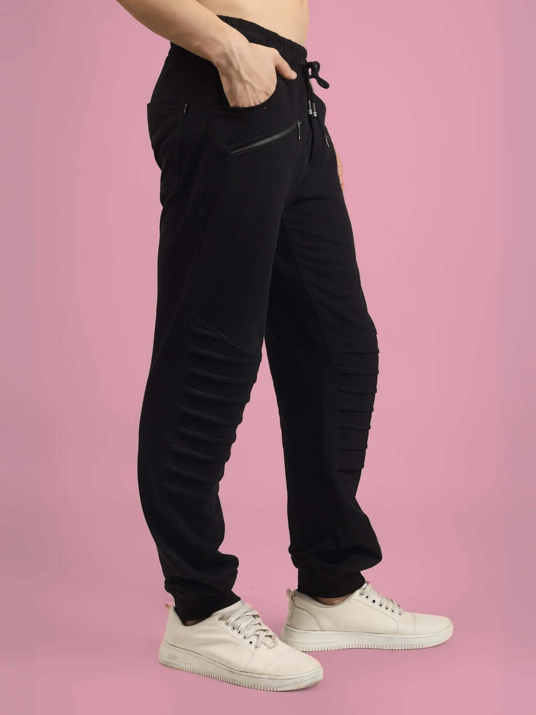 Model wearing 2 ZIPPER POCKET COTTON JOGGER BLACK with white sneakers, showcasing streetwear style and comfort.