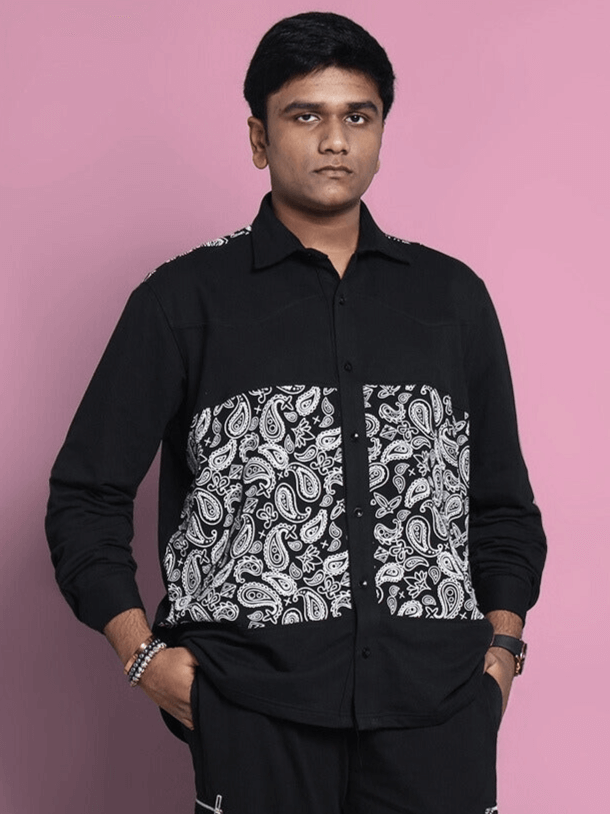 Model wearing black COVE shirt by DUDS, featuring paisley detailing, customizable size options, made-to-order fashion.