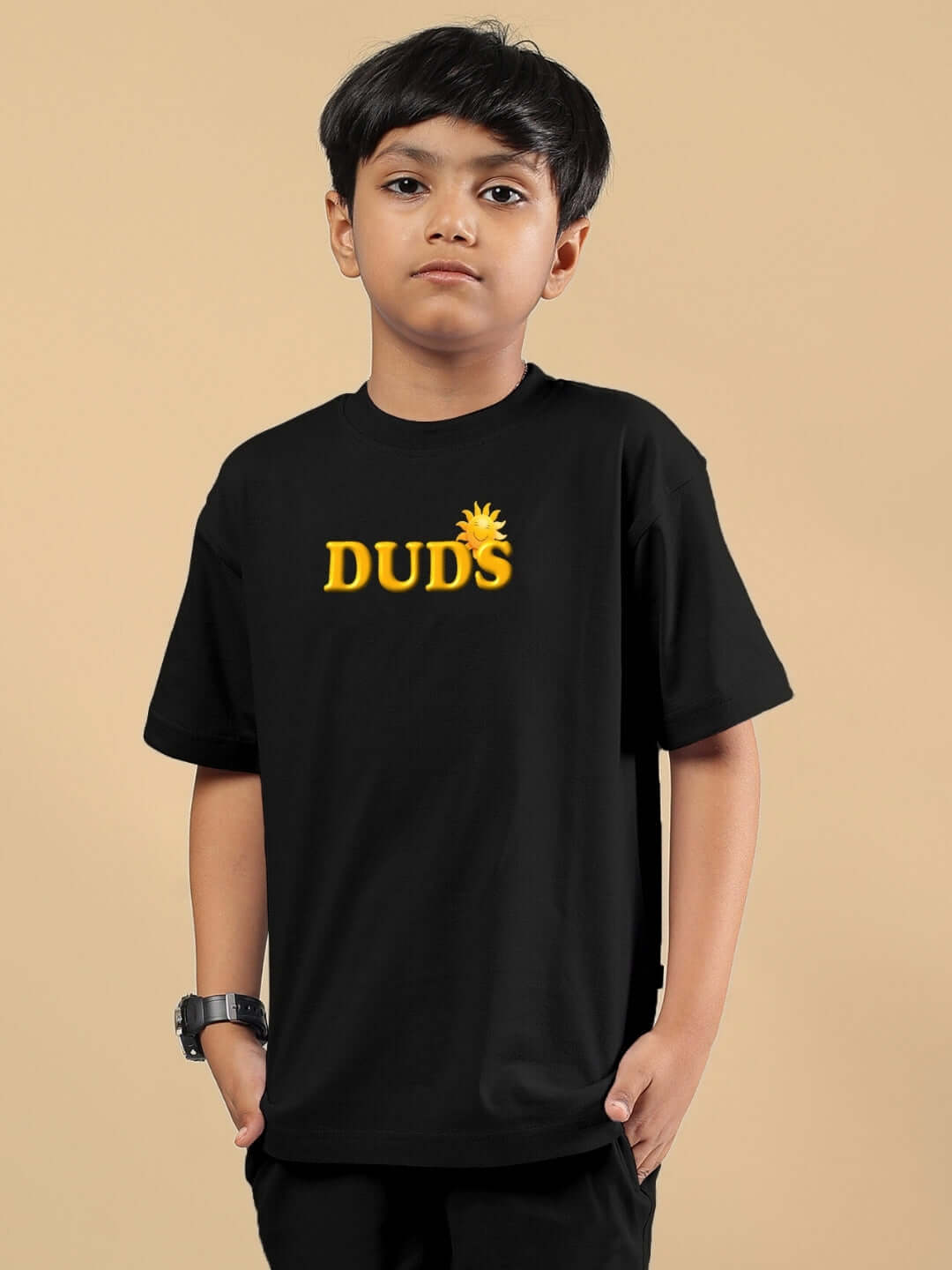 Child wearing a black LABUBU Monsters T-shirt by DUDS, showcasing a casual style for boys and girls.