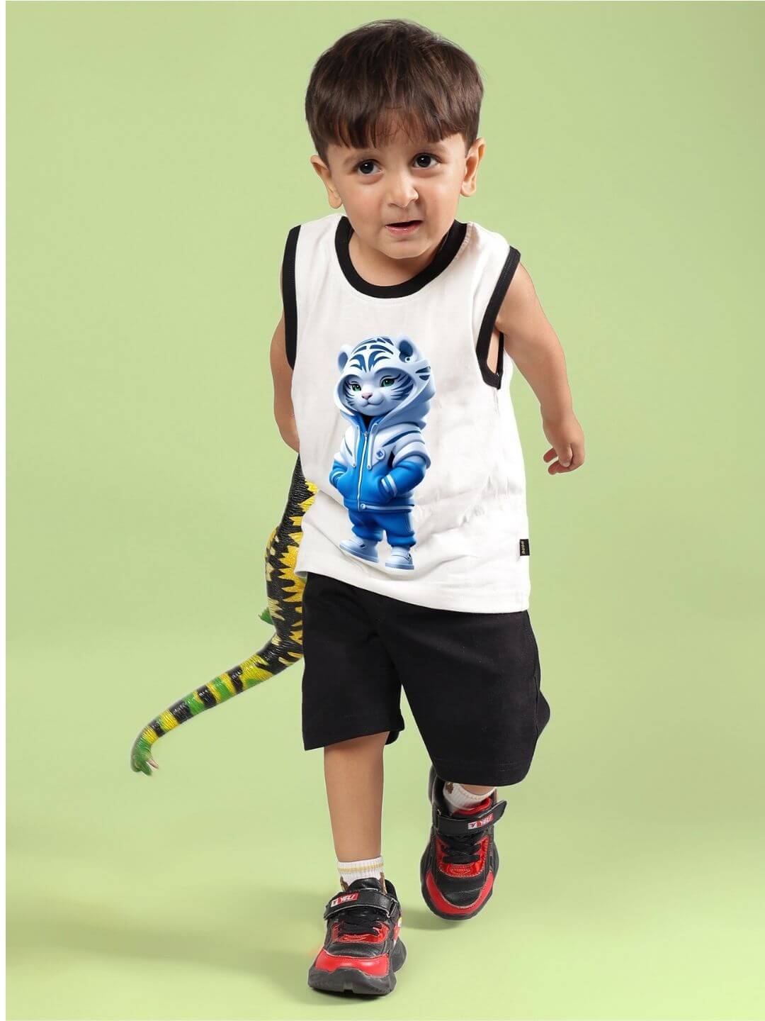 Child wearing BLUE CAT SUMMER CO-ORD FOR BOYS AND GIRLS OFF WHITE-BLACK with playful cat print on a light green background.