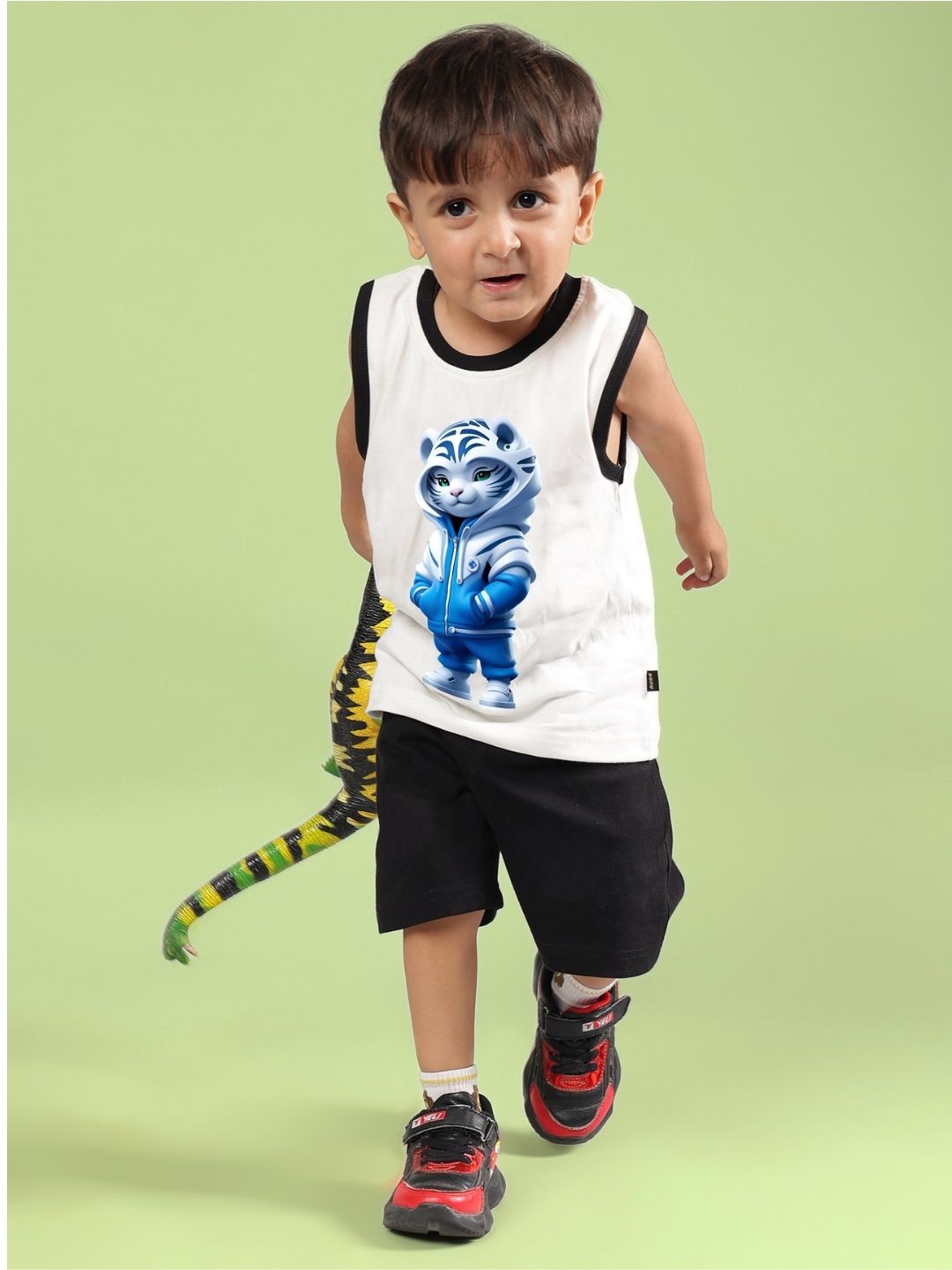 Child wearing Blue Cat co-ord set in off white and black with playful cat design, ideal unisex summer outfit for boys and girls.