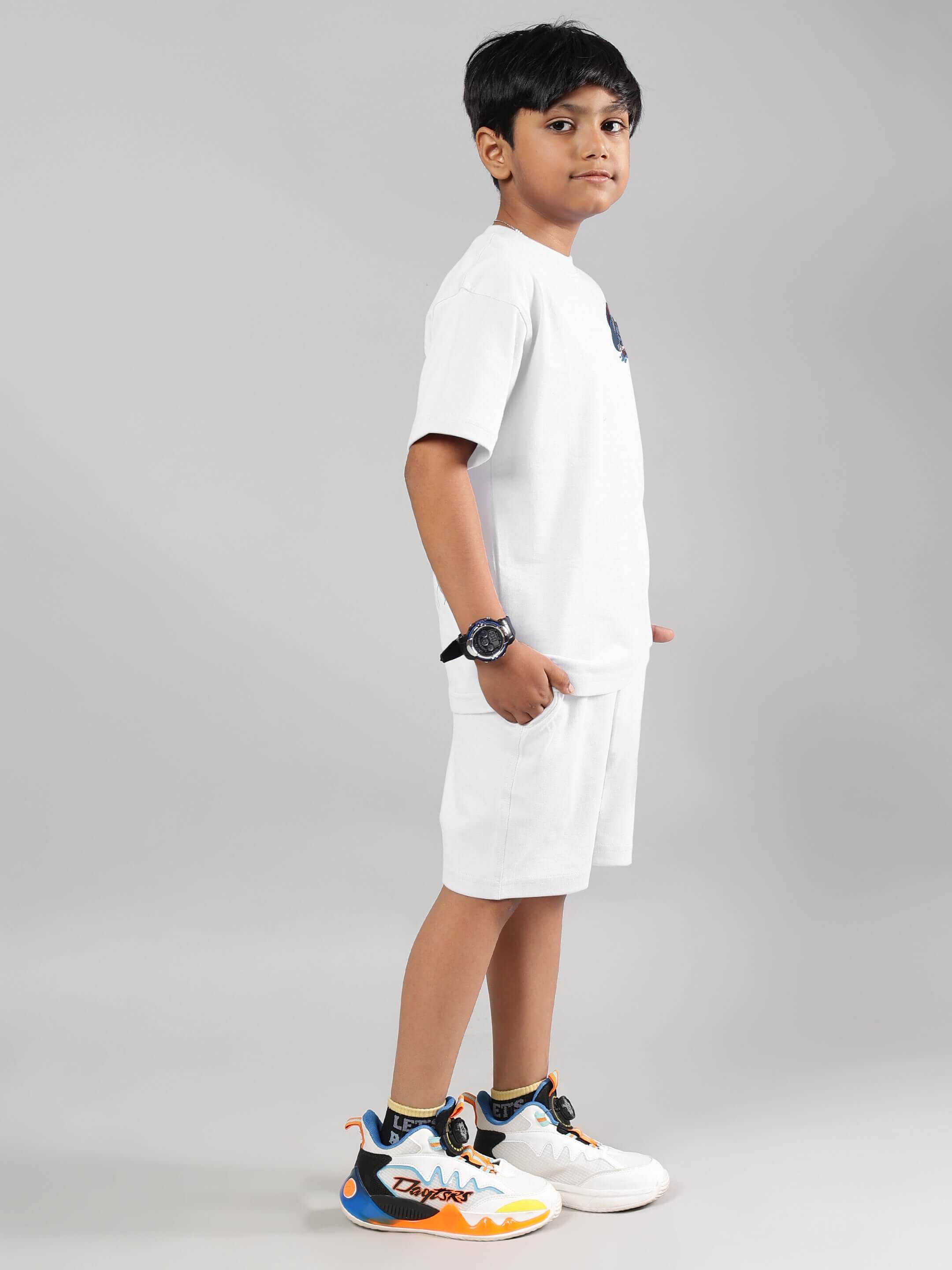 Child wearing BLUE LAPIN CO-ORD FOR BOYS GIRLS WHITE, unisex cotton outfit, side view, casual style, comfortable for summer.