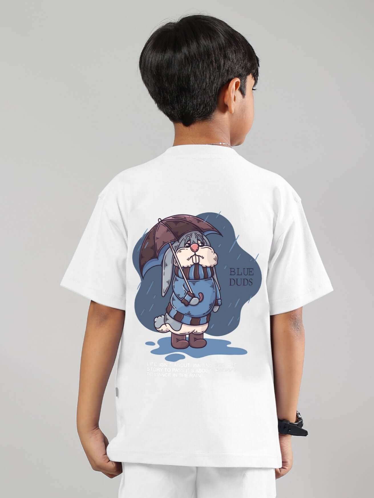 Child wearing a Blue Lapin white t-shirt with cartoon character design on the back, suitable for boys and girls.