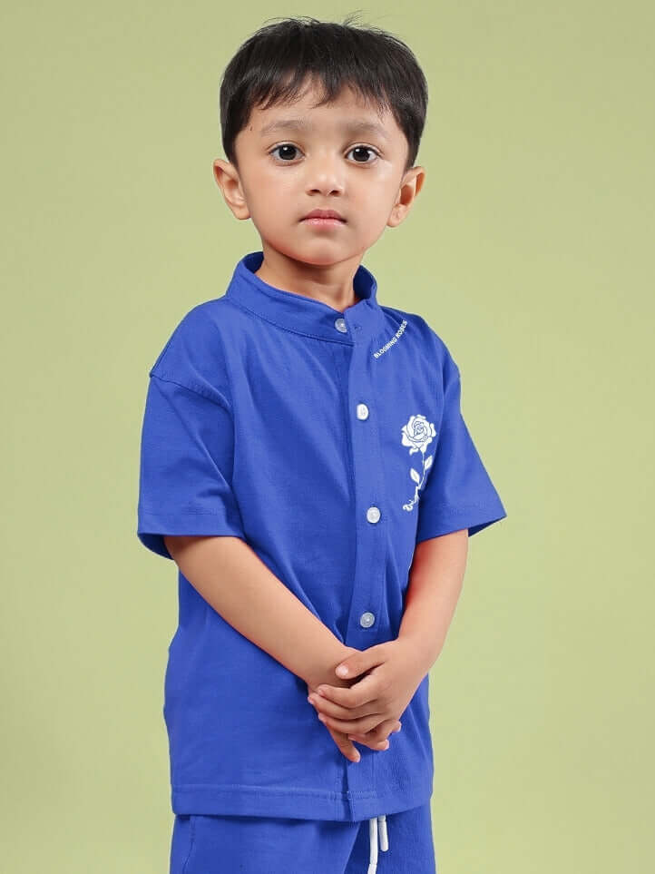Child wearing LIMBO SHIRT FOR BOYS & GIRLS BLUE showcasing its casual and comfortable design.