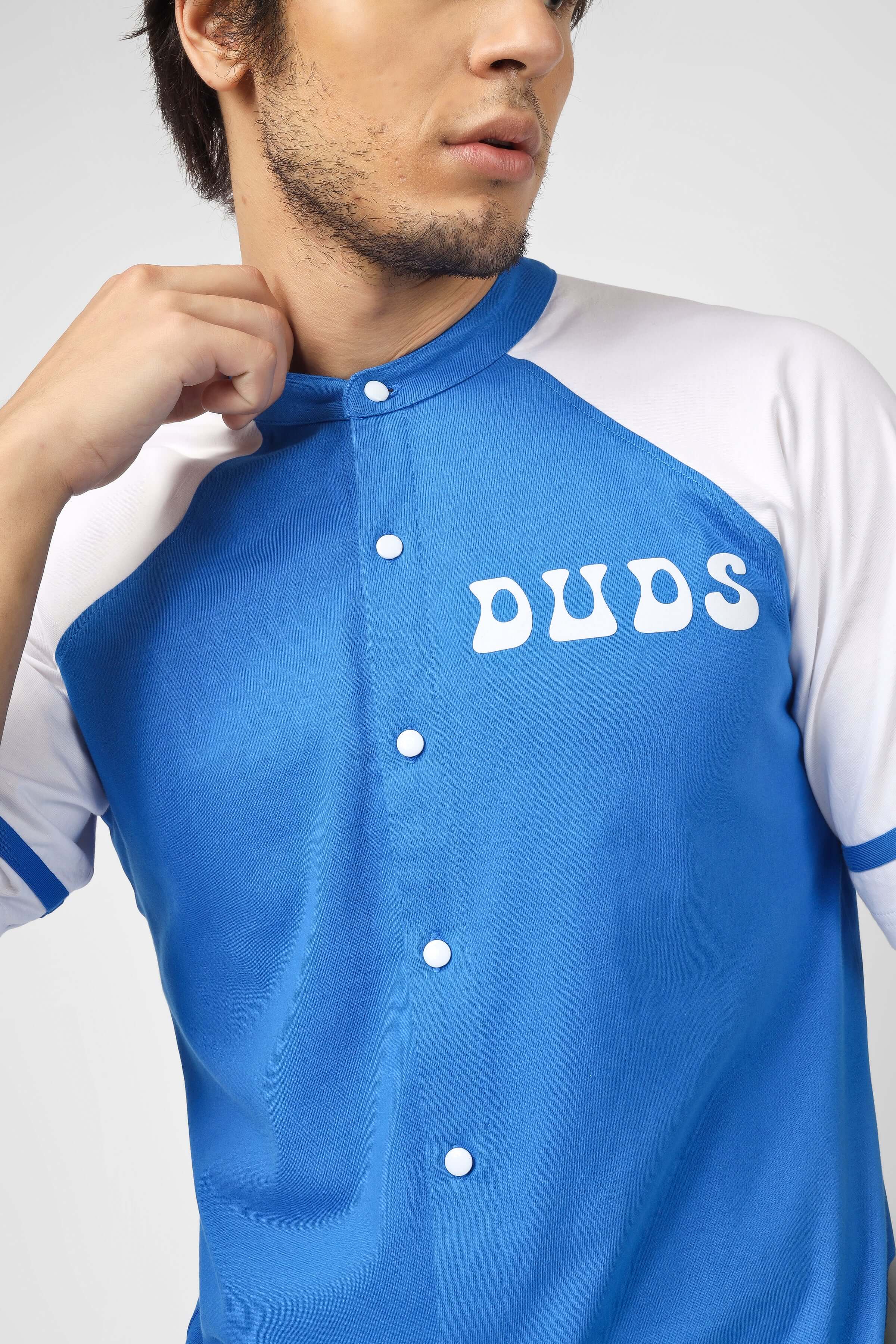 Model wearing blue and white RAGLAN OS T-SHIRT WITH SKULL BUTTERFLY PRINT BLUE, streetwear fashion