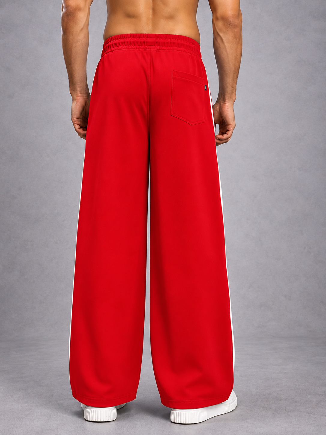 Back view of BOLD ELECTRIC RELAXED FIT JOGGERS RED WHITE, streetwear style with relaxed silhouette