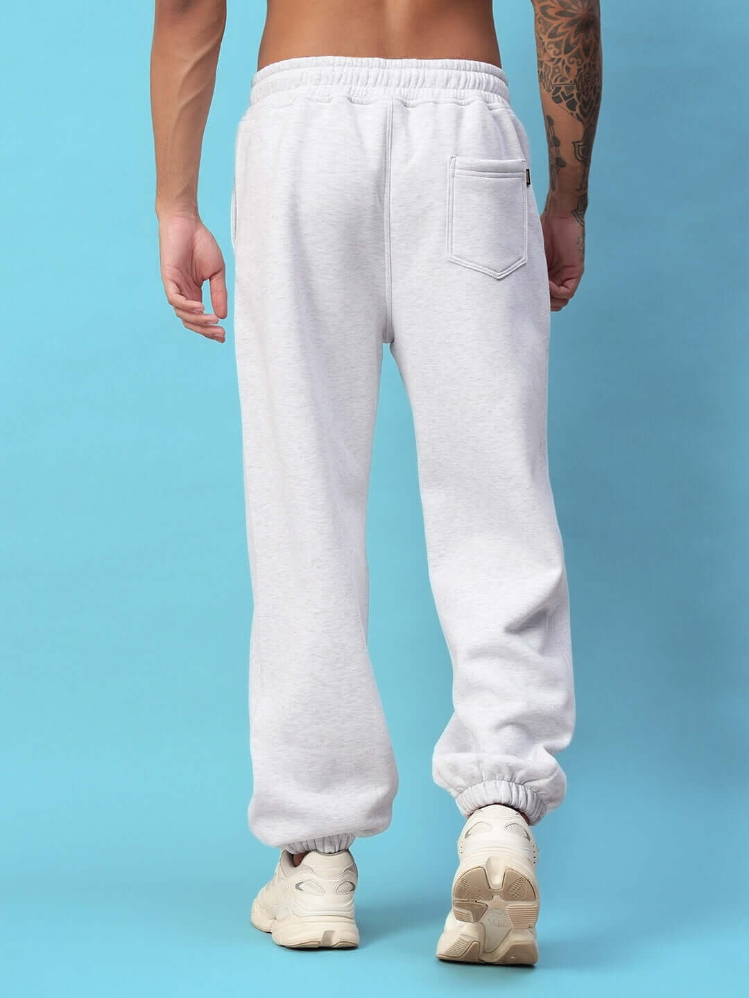 Rear view of person wearing Bona-Fide Fleece Pant in melange grey, showcasing soft, durable fabric fit for casual wear and comfort.