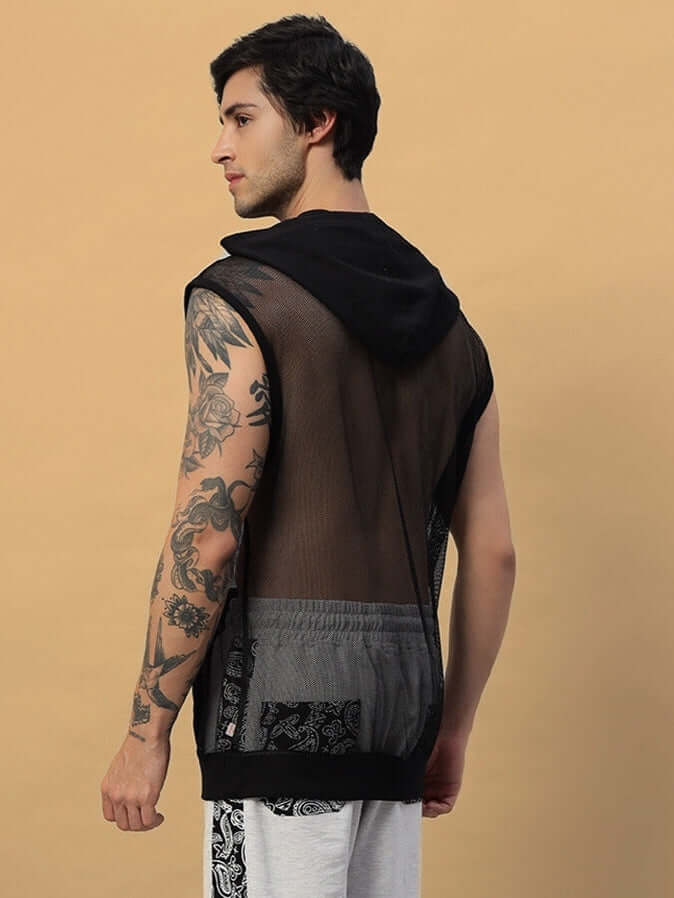 Model wearing Boogie Mesh Sleeveless Hoodie Vest in black with tattooed arm, showing back design.