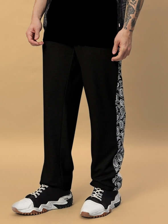 Man wearing Boogie Relaxed Fit Black Joggers with side pattern, customized fit available, handmade by DUDS tailors.
