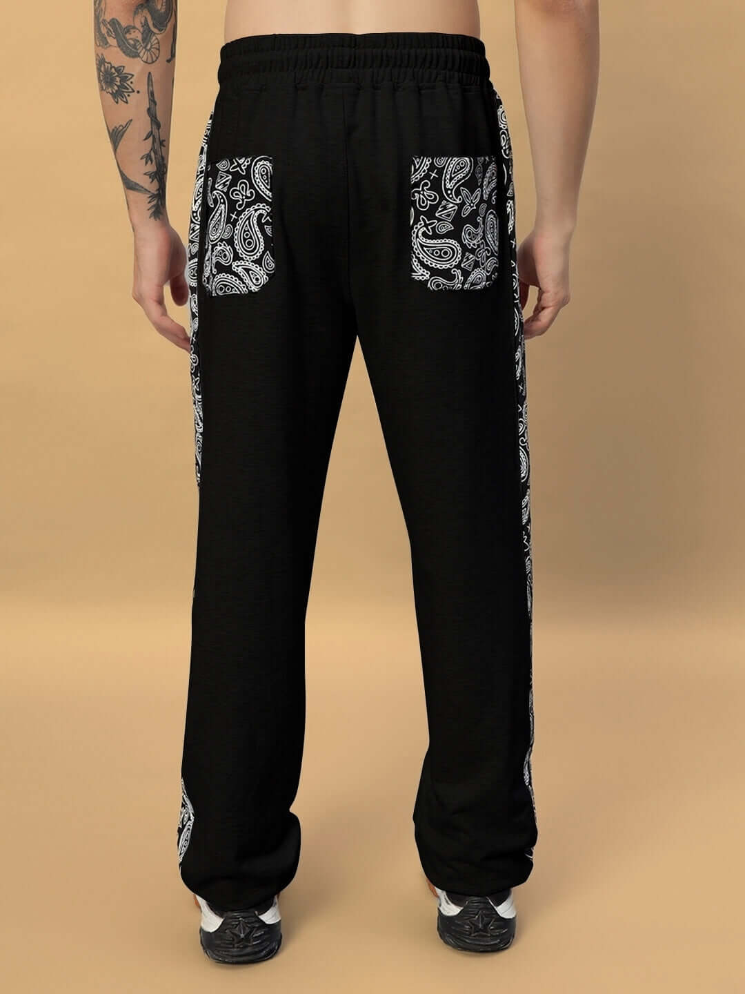 Back view of Boogie Relaxed Fit Joggers in black featuring paisley print pockets, tailored for comfort and style.
