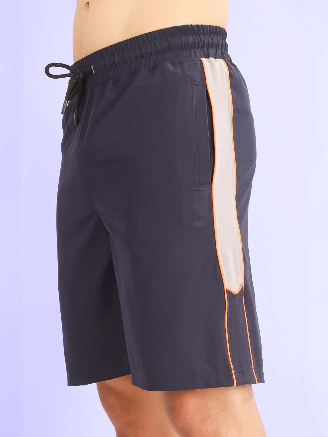 BOOMER SHORTS NAVY WITH ORANGE PIPING featuring deep navy color and vibrant orange accents, ideal for athletic and streetwear style.