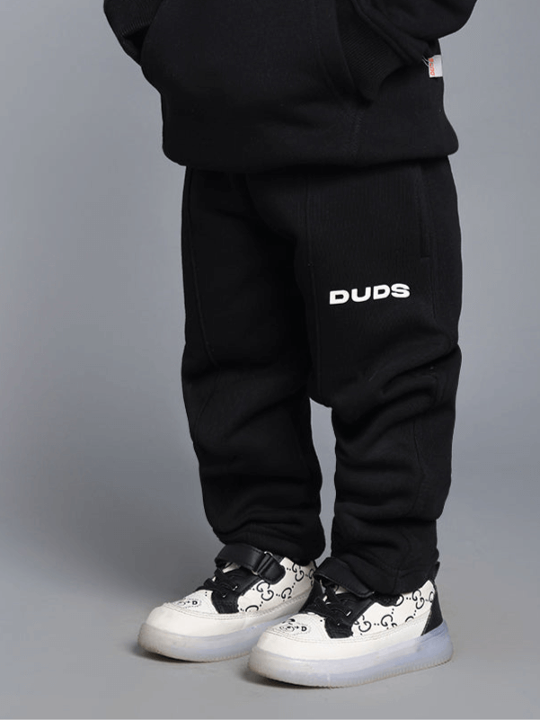 Kid wearing BORN TO SHINE CO-ORD FOR BOYS GIRLS BLACK outfit, featuring black oversized t-shirt and relaxed shorts, perfect for versatile wear.