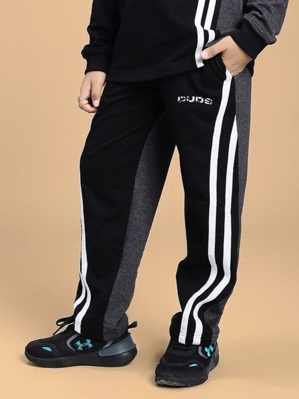 Child wearing BOSCO STRIPE JOGGER FOR BOYS AND GIRLS BLACK DARK GREY, showcasing trendy and comfortable joggers for active kids.